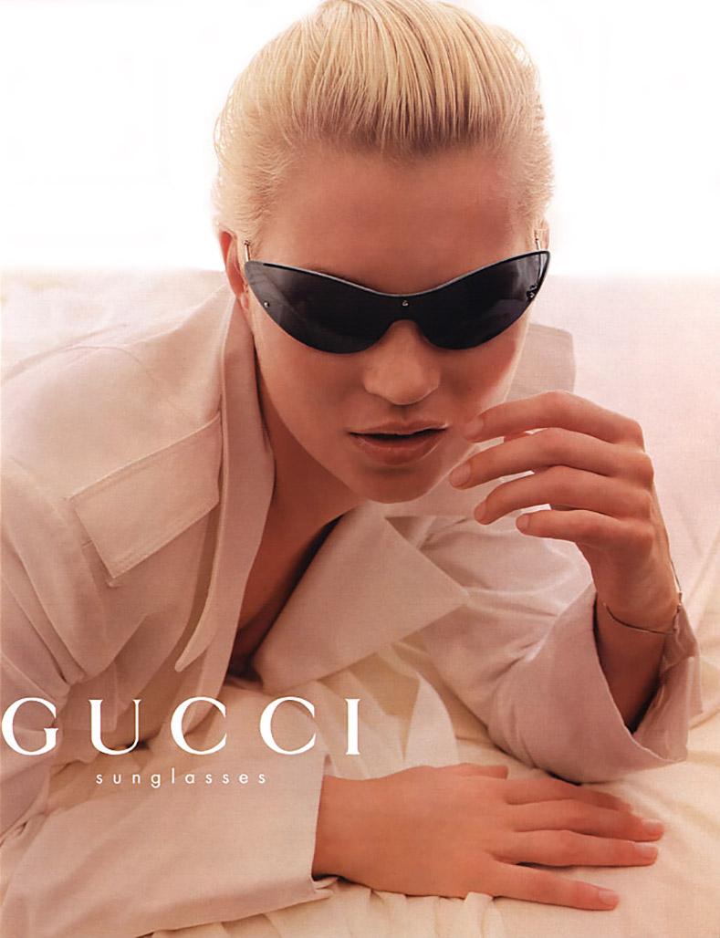Gucci Vintage 2001 Spring Tom Ford sunglasses.  The darker opaque version is pictured in the ad campaign with Kate Moss.  Clear grey lens shield / wrap style. Excellent pre-owned condition with case and cloth.  
