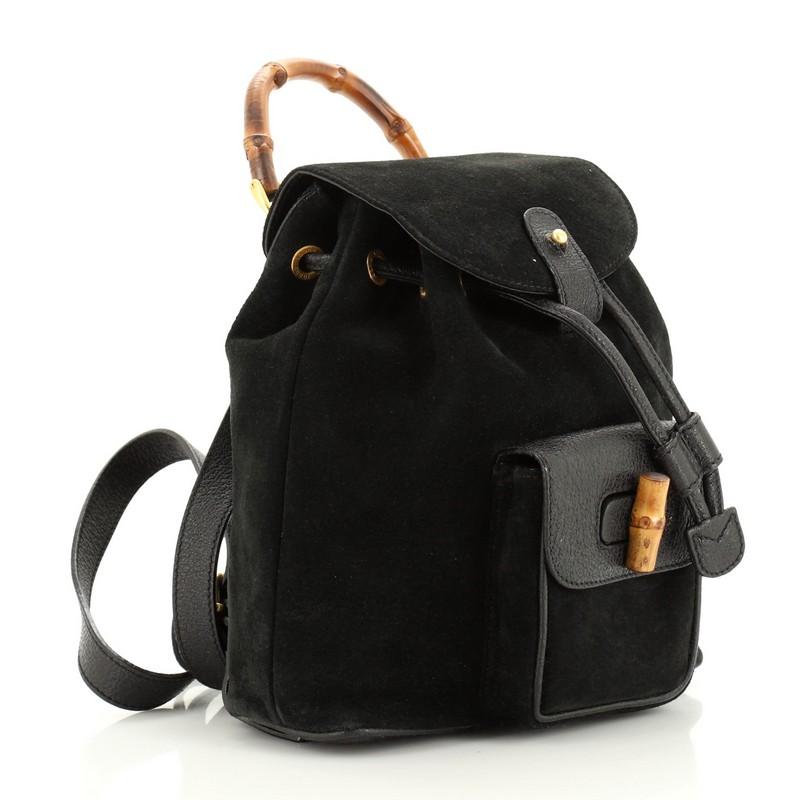 Condition: Good. Heavy discoloration and wear on exterior, moderate creasing and wear on straps, wear and peeling on drawstring. Cracking, peeling and splitting on strap wax edges, light wear in interior, scratches on hardware. 
Accessories: No