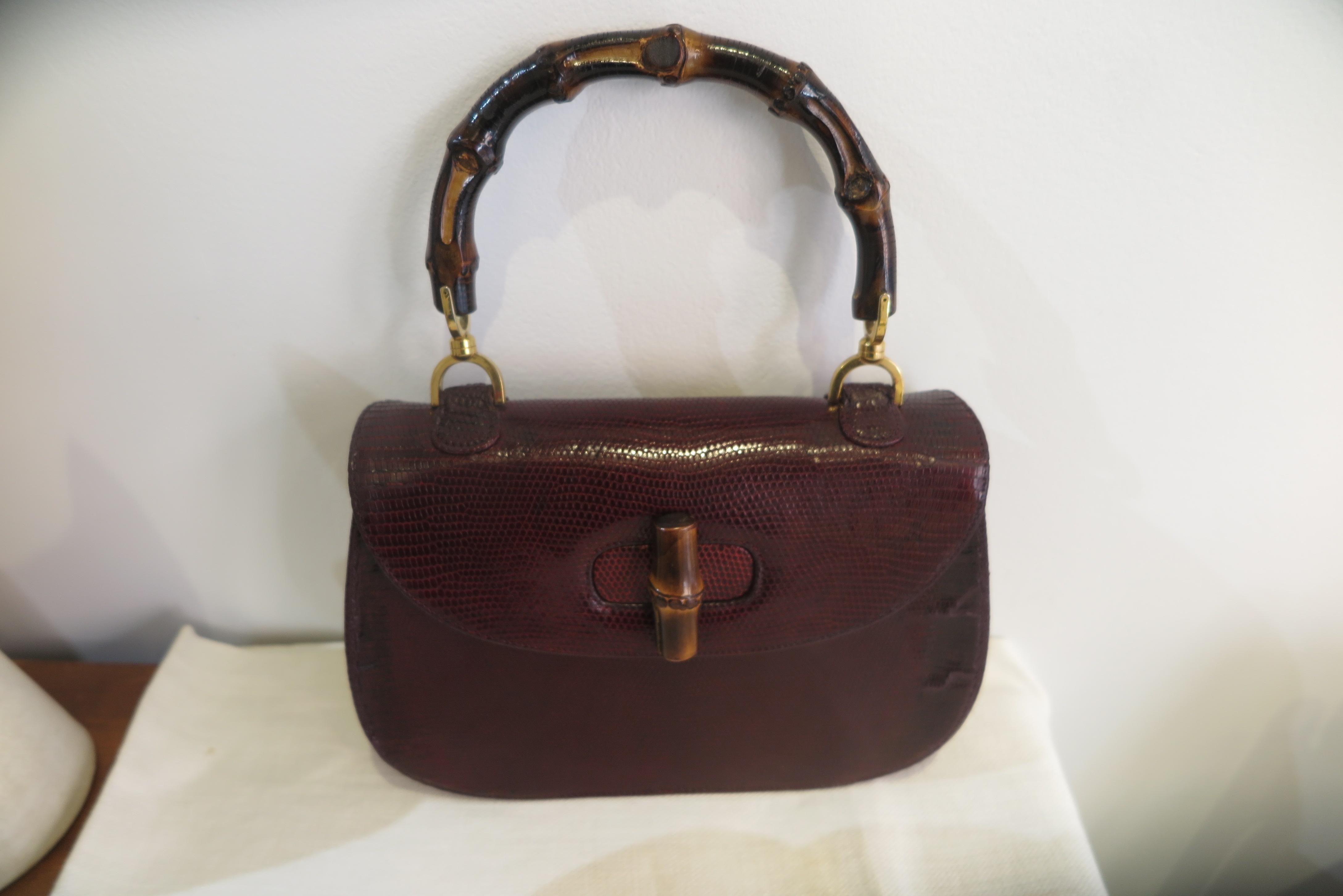 This iconic handbag is one of the most famous and recognizable design by Gucci from circa 1960.
Handbag in burgundy snakeskin with bamboo handle and gold foil 