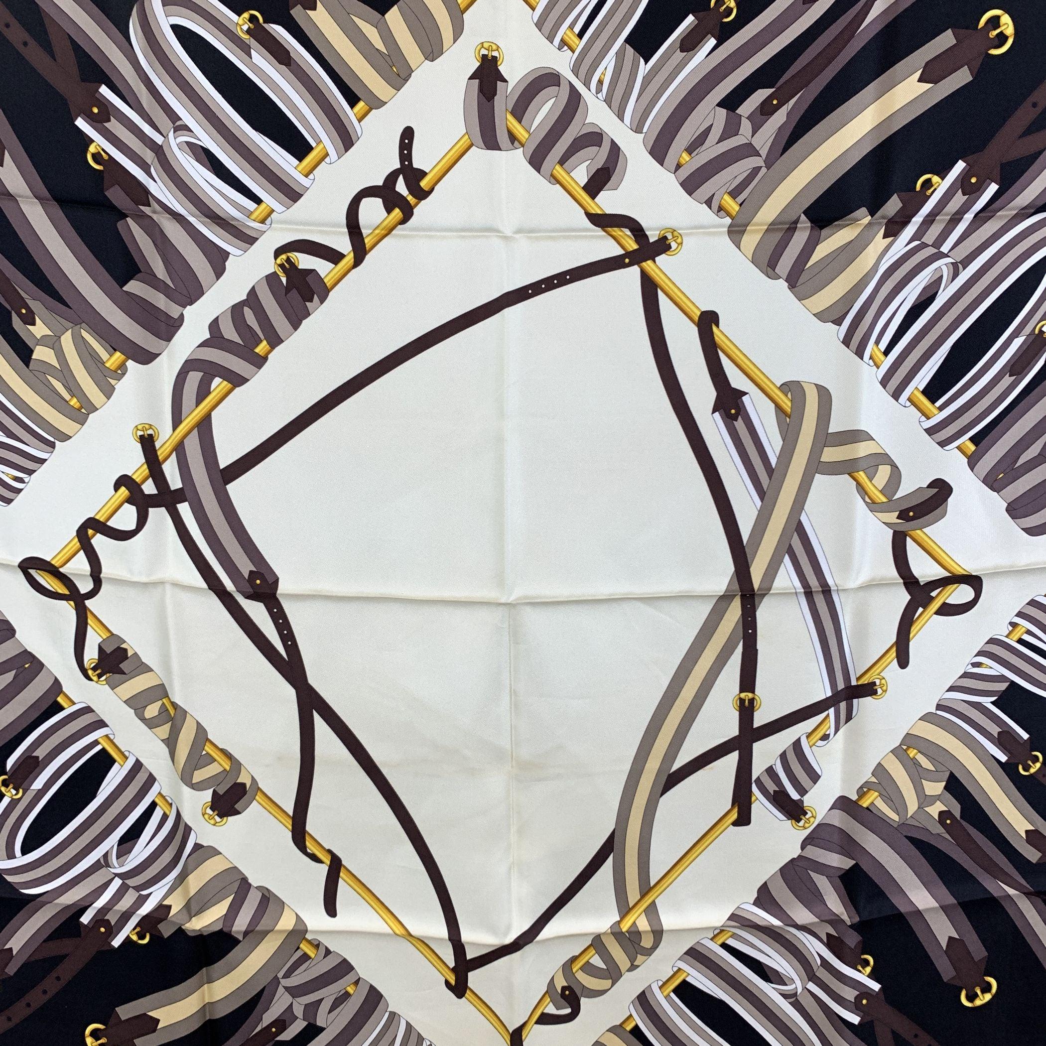 Step into a world of timeless luxury with this vintage Gucci silk scarf. Featuring a stunning blend of beige, brown, white, and black tones, the scarf boasts an elegant belts and buckles design that speaks to the brand's rich heritage. Made in