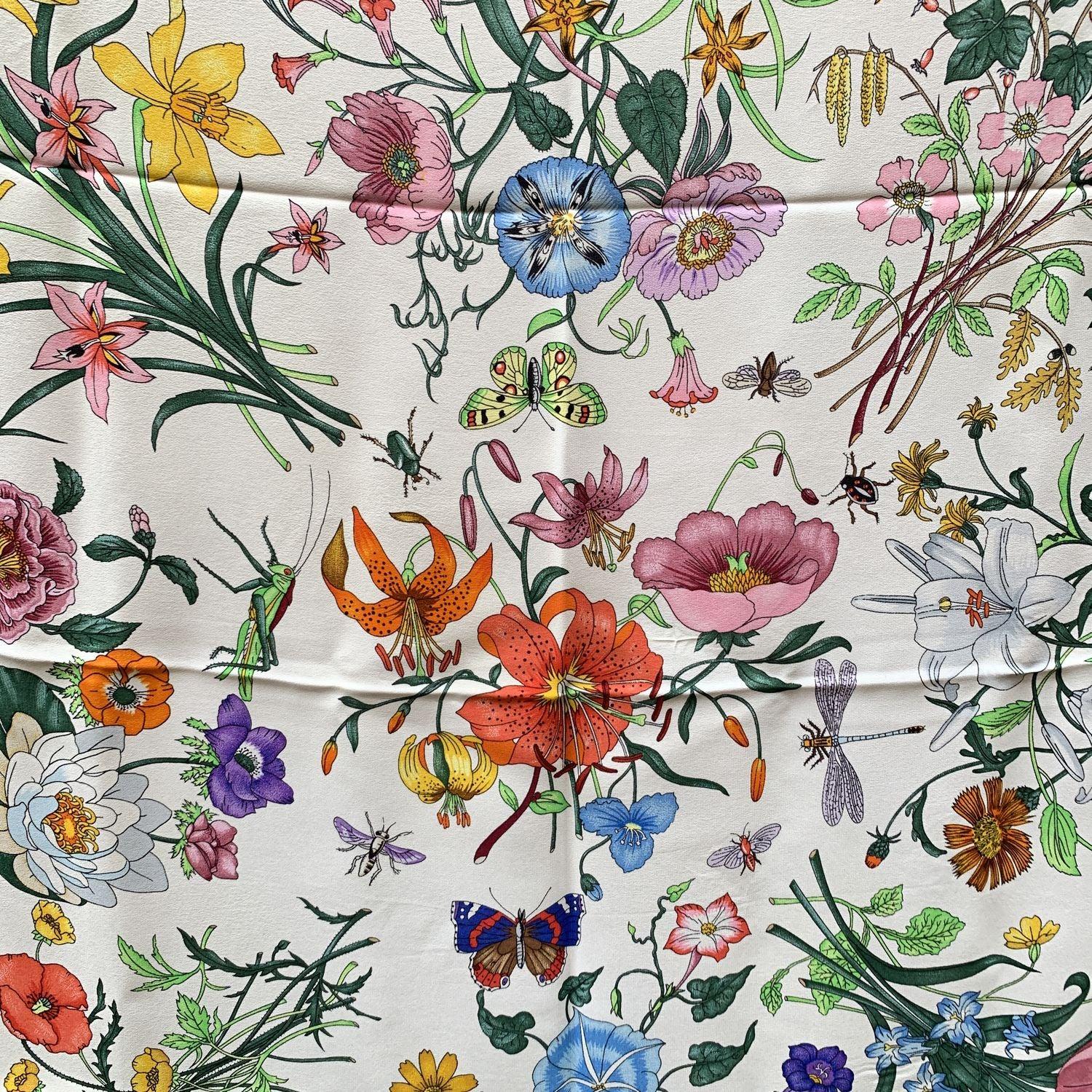 The Flora silk scarf born in 1966 by the artist Vittorio Accornero. He was the textile designer for Gucci between the 1960s and 1981. The Flora design is a magical and delicate composition of flowers, berries and insects depicted with the precision
