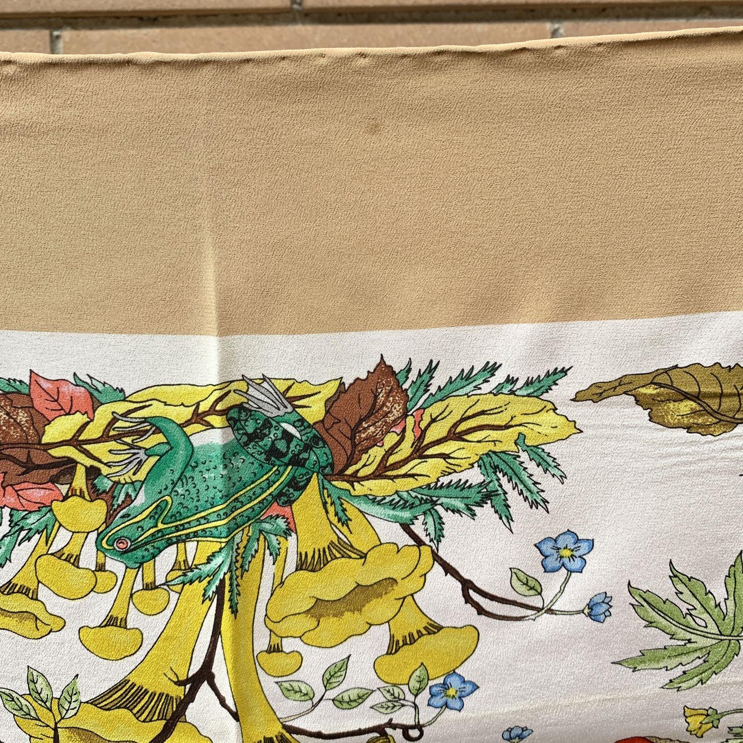 Gucci Vintage Beige Floral 'Funghi' (Mushrooms) Silk Scarf. Designed by Vittorio Accornero for GUCCI in 1967. Multicolor flowers and mushrooms design. Beige borders. 100% Silk. Measurements: 34.5 x 34.5 inches - 87,5 x 87,5 cm. Printed GUCCI