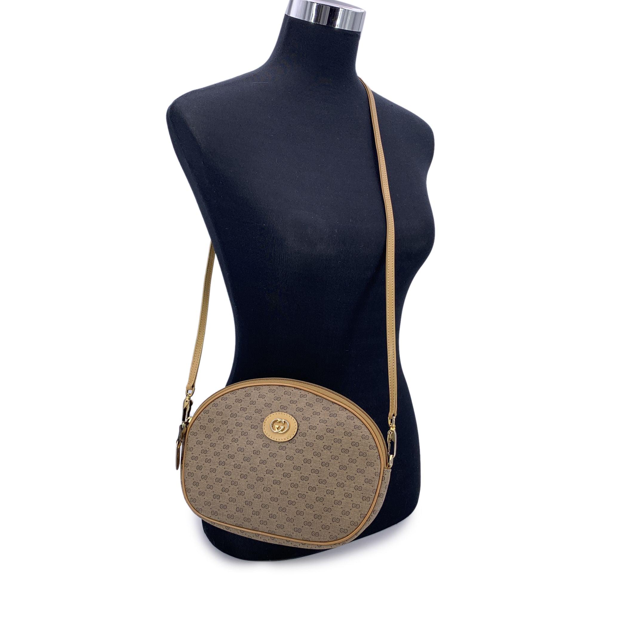 A charming nod to classic Italian design, this lovely small Vintage Gucci crossbody bag is a perfect blend of heritage and everyday elegance. Crafted in Gucci's signature beige monogram canvas with rich tan leather trim, it's a piece that carries