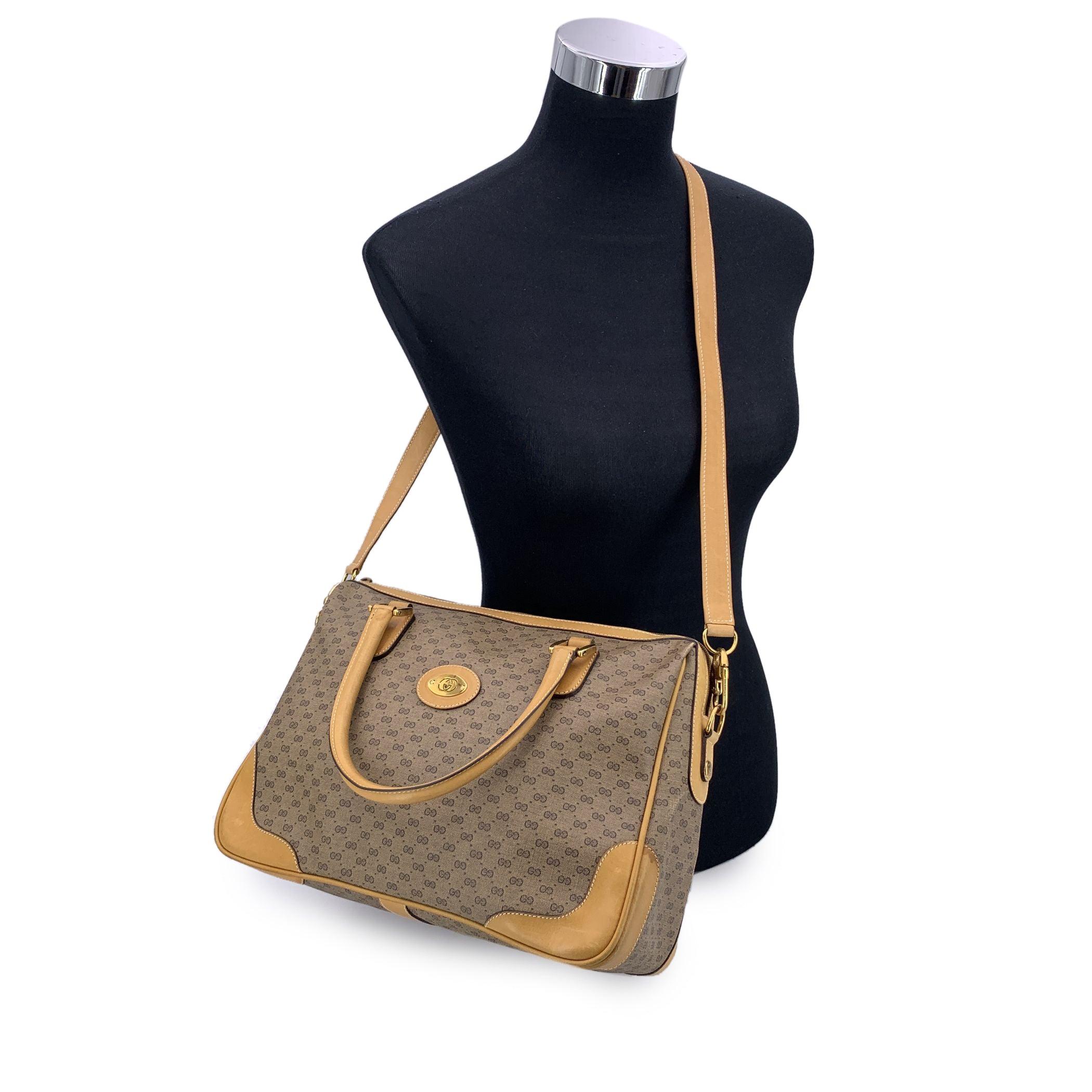 Step into a world of timeless sophistication with this exquisite vintage Gucci satchel, a true icon of luxury and enduring style. Crafted from Gucci's signature beige monogram canvas and trimmed with rich tan leather, this piece marries elegance