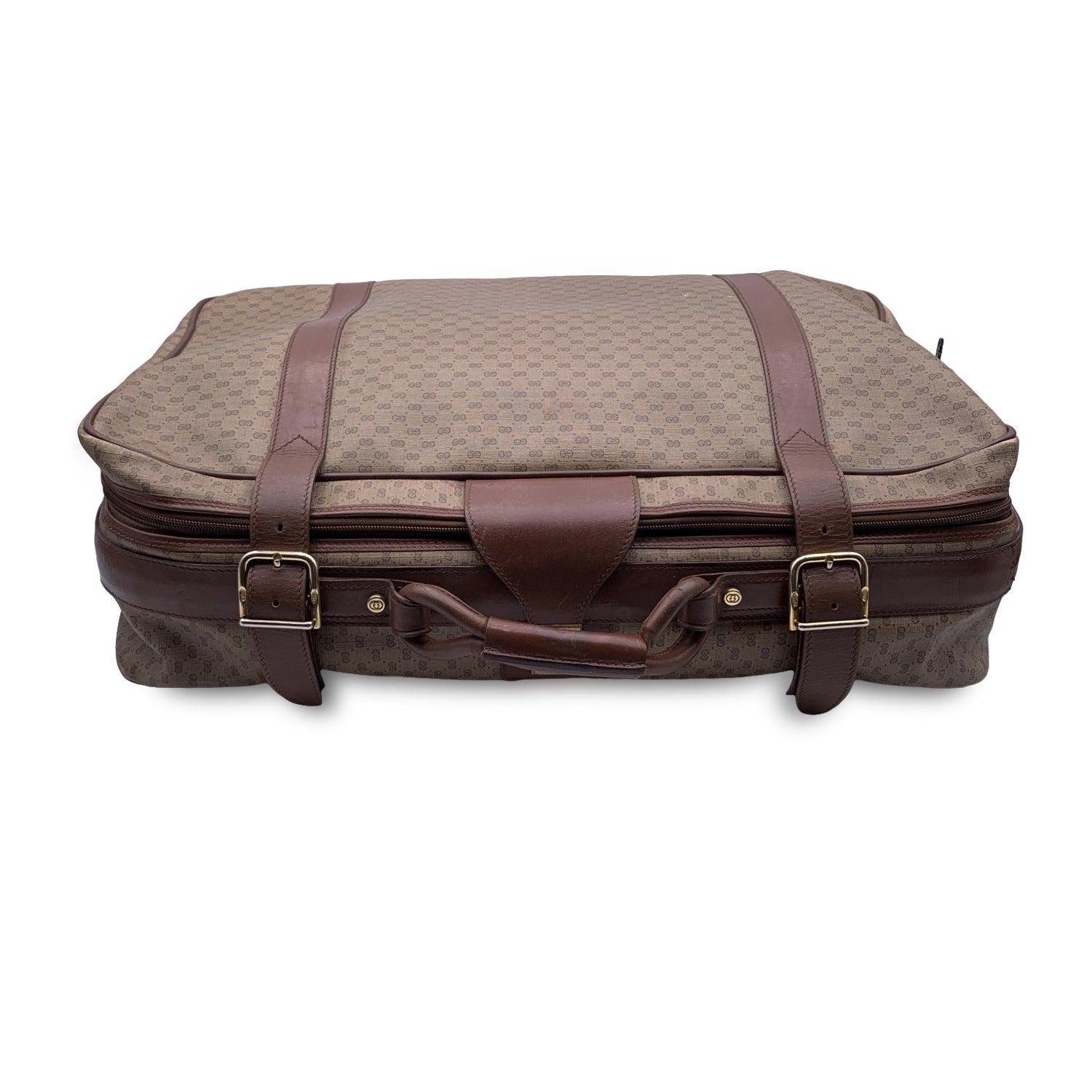 This beautiful Bag will come with a Certificate of Authenticity provided by Entrupy. The certificate will be provided at no further cost GUCCI Tan GG Monogram Canvas Suitcase. Tan GG - GUCCI monogram canvas. Double Wrap-around zipper + fold over