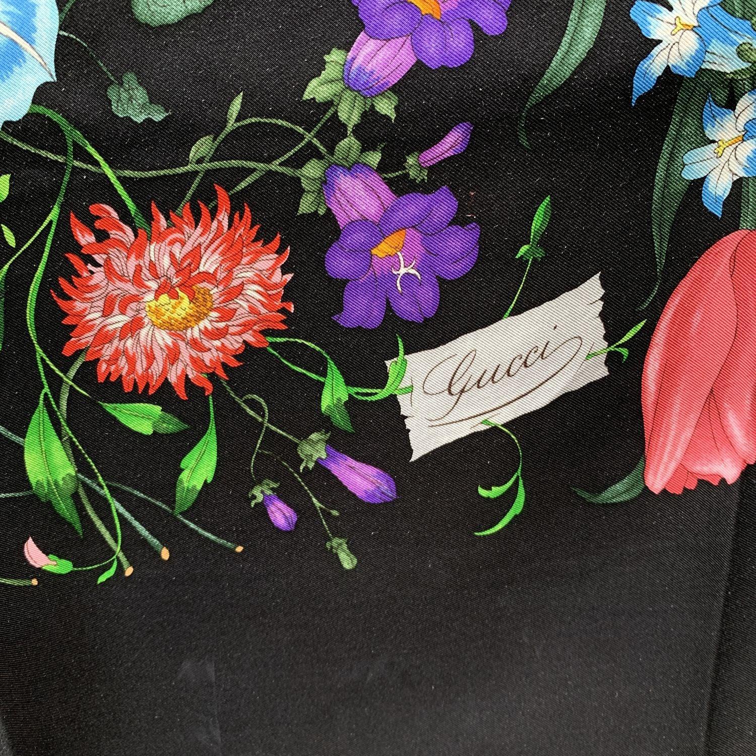 - Title: 'Flora' - Multicolor floral design on black background - 100% Silk - Printed GUCCI signature The Flora design born in 1966 by the artist Vittorio Accornero. He was the textile designer for Gucci between the 1960s and 1981. The Flora design