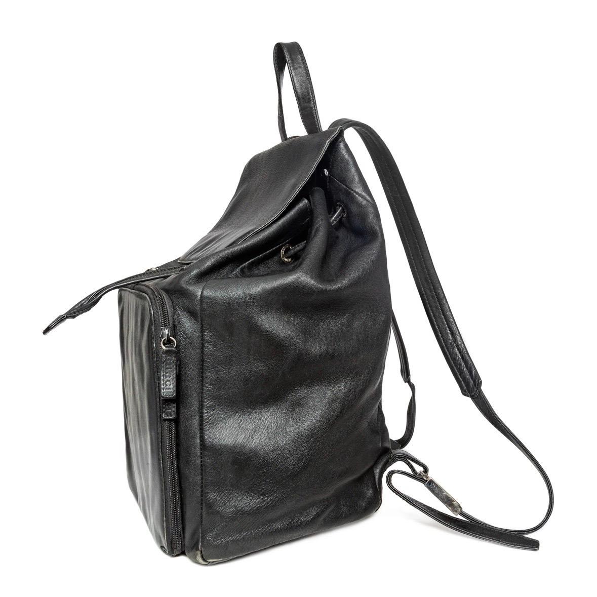 Gucci Vintage Black Leather Drawstring Backpack

Vintage; circa late 90s–early 2000s
Tom Ford for Gucci
Solid Black
Silver-tone hardware
Flap top with drawstring closure
Zippered outer compartment and pocket
Top hook 
Adjustable back straps; lift