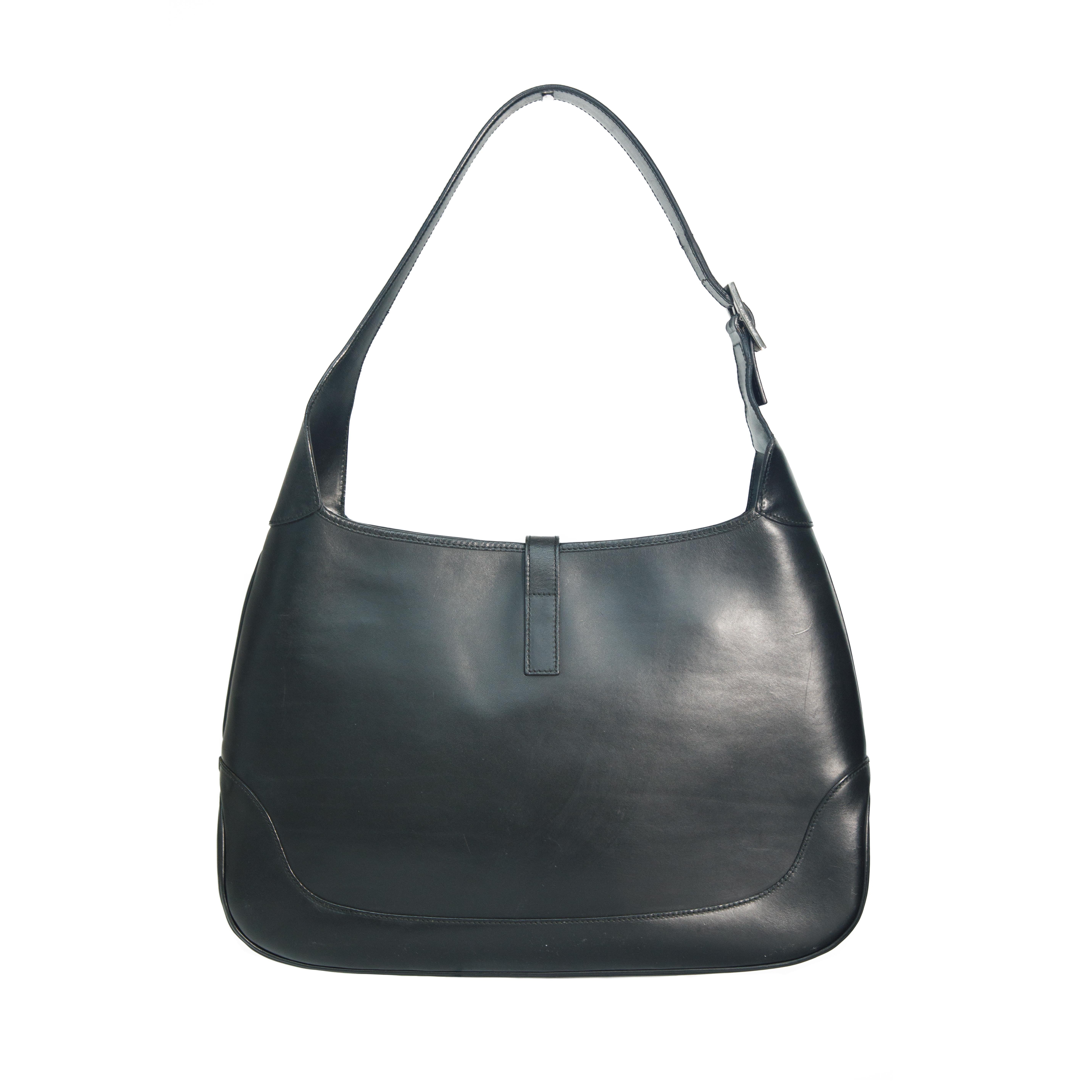 Ruder Than The Rest presents a Gucci vintage black full leather Jackie handbag.

Chrome hardware and piston clasp.

Smooth and flawless lambs leather.

Size large Jackie bag.

Made in Italy.

Vintage, circa 2000s.

Authenticity guaranteed.

Comes