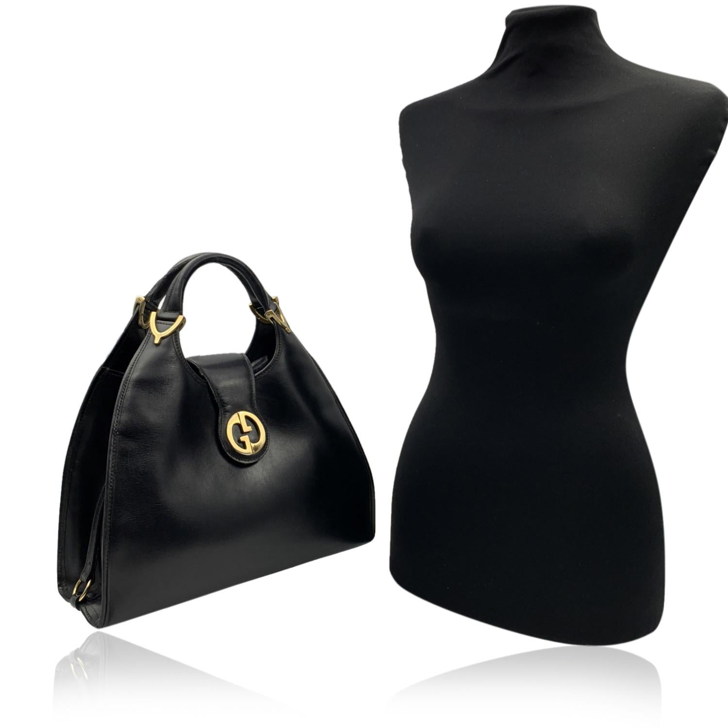 Beautiful Gucci 'Stirrup' hobo bag, crafted in black leather. Fold over strap with button closure.Gold metal GG - GUCCI logo on the front. Leather lining with 1 side zip pocket inside. 'Gucci Italy' crest embossed inside.



Details

MATERIAL: