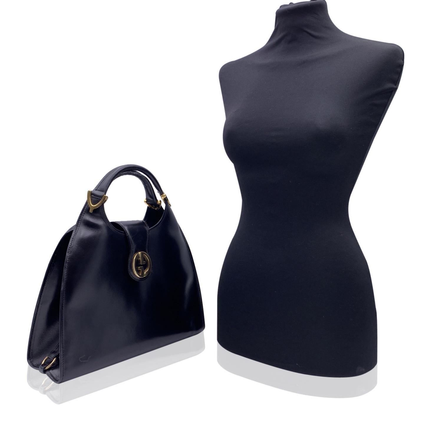 Beautiful Gucci 'Stirrup' hobo bag, crafted in black leather. Fold over strap with button closure.Gold metal GG - GUCCI logo on the front. Leather lining with 1 side zip pocket inside. 'Gucci Italy' crest embossed inside.



Details

MATERIAL:
