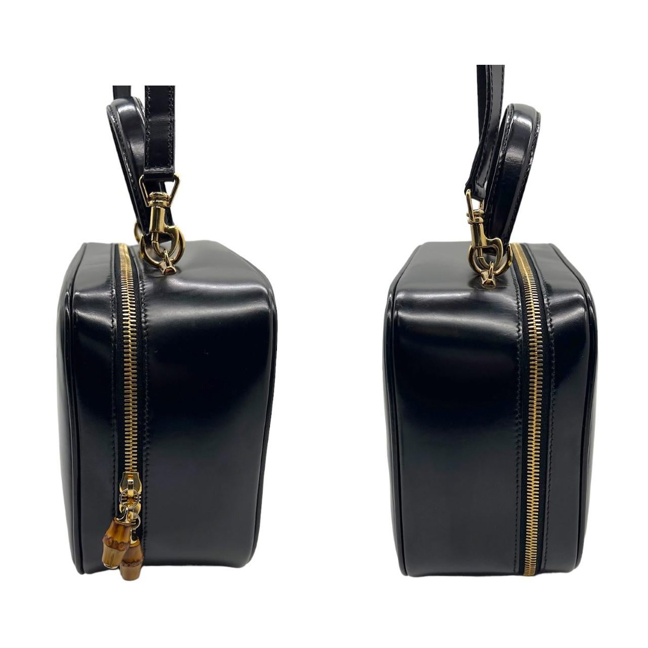 We are offering this beautiful Gucci vanity case. Made in Italy, this case is made with a black leather exterior with a removeable black leather shoulder strap and a gold-tone hardware zip up closure. It features bamboo detailed zipper pulls and it