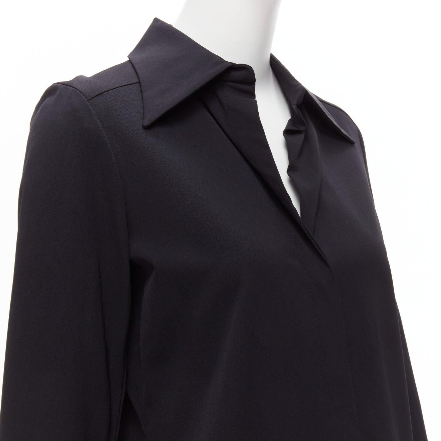 GUCCI Vintage black minimal concealed buttons wide collar shirt top IT38 XS
Reference: TGAS/D00560
Brand: Gucci
Material: Rayon, Blend
Color: Black
Pattern: Solid
Closure: Button
Extra Details: Invisible placket.
Made in: