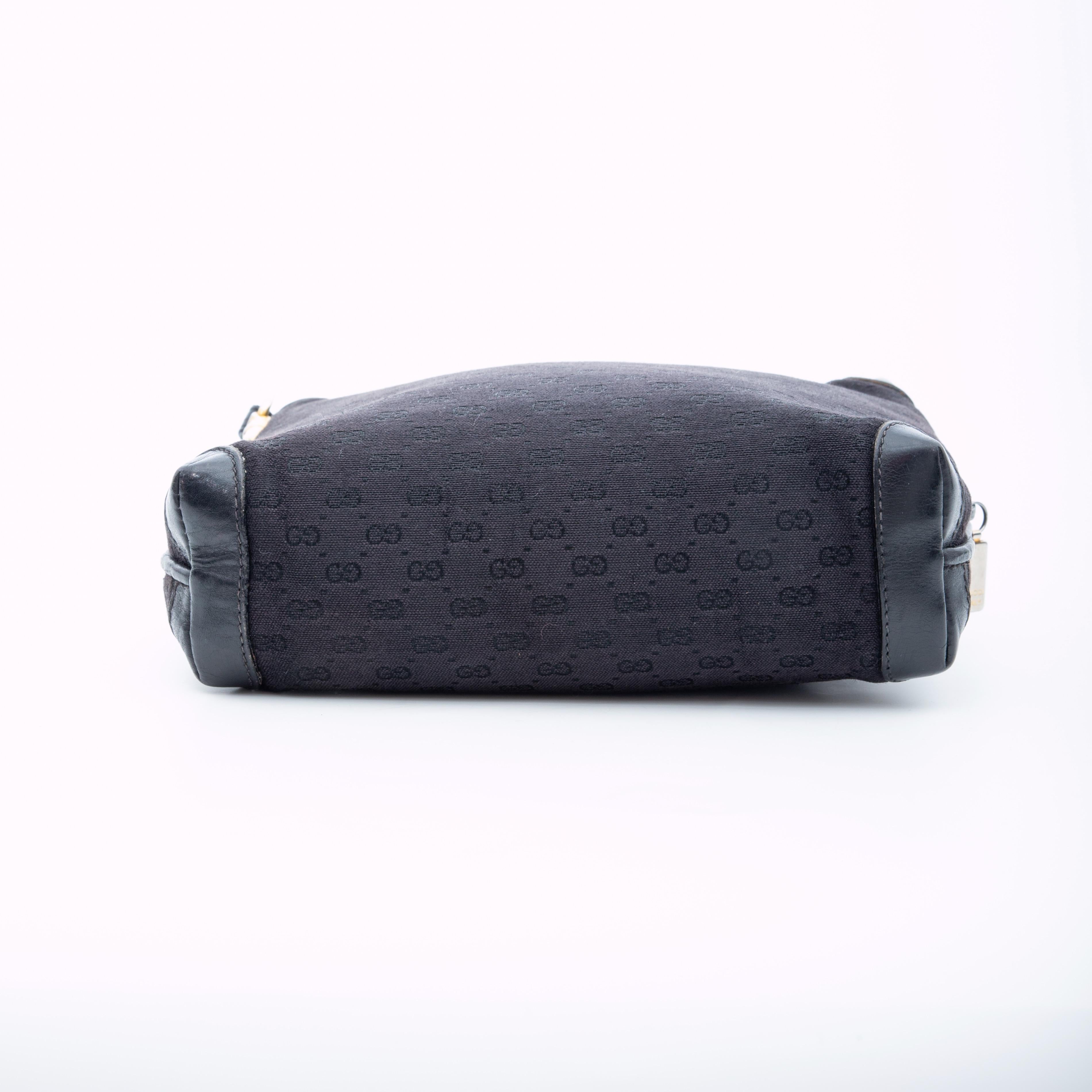 COLOR: Black
MATERIAL: Cloth
ITEM CODE: 07-37-4916
MEASURES: H 7” x L 8” x D 2.5”
DROP: 21”
COMES WITH: Dust bag
CONDITION: Good - discolouration to interior. No stickiness, but some pealing. Leather shoulder strap has been replaced. 

Made in Italy