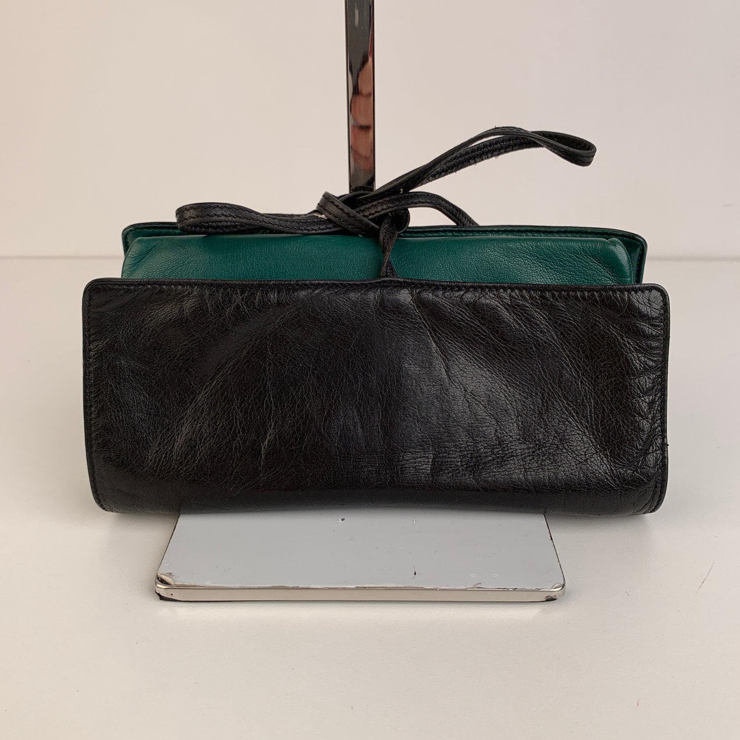 Nice GUCCI Jewelry case crafted in soft black leather. Green leather on the inside. 4 zip compartments and self-tie closure. It will keep your jewelry protected and organized and safe while on the go. A perfect travel companion that with tuck nicely