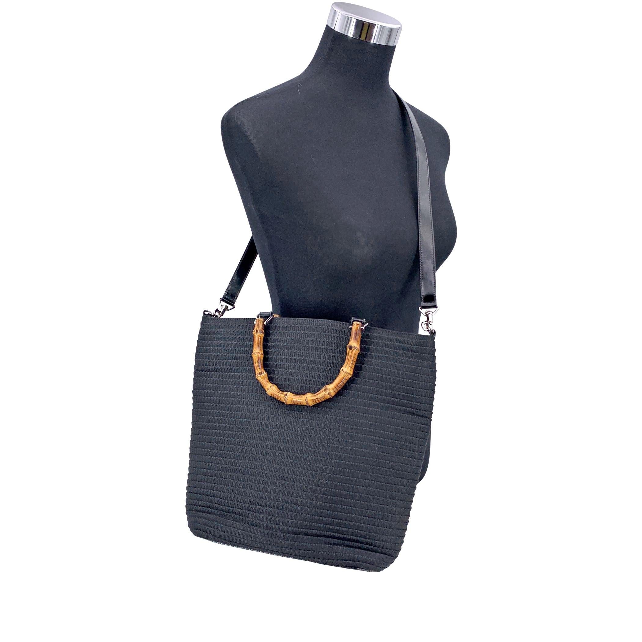 A beautiful nod to Gucci's timeless craftsmanship, this Gucci Bamboo tote bag in classic black canvas captures quiet luxury with iconic flair. The bag features intricate stitching throughout, adding texture and depth to its refined silhouette. Its