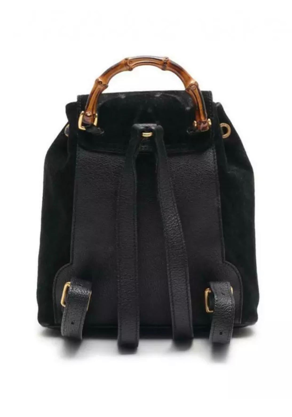 This backpack features a suede body, flat leather back straps, bamboo top handle, top flap with button closure, drawstring closure, exterior flap pocket with bamboo twist lock closure, and interior zip pocket.   
Dimensions (cm) : 24 x 22 x 7  
