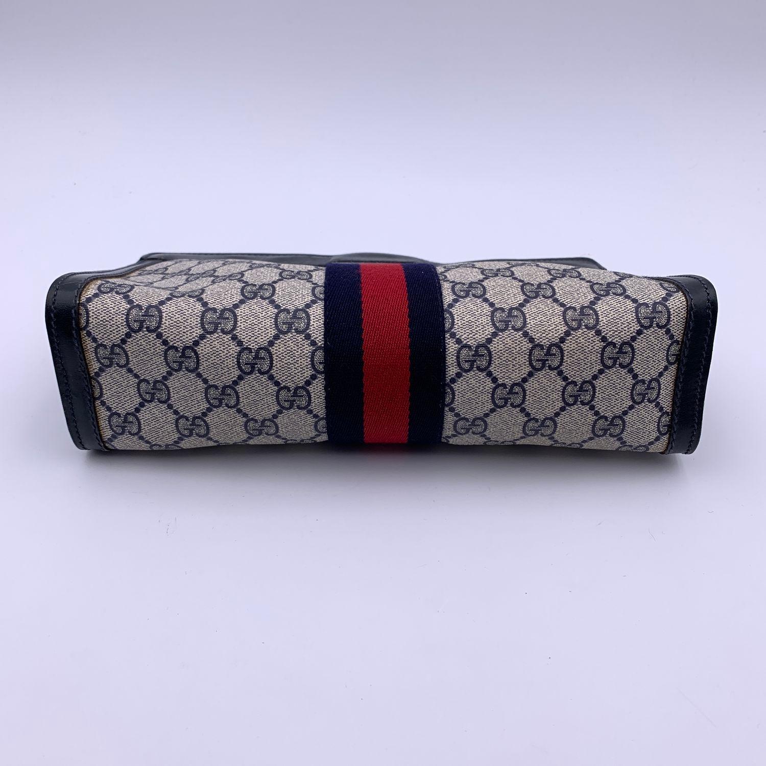 vintage gucci monogram clutch