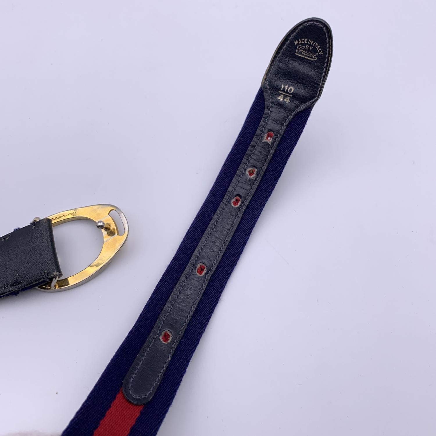 Vintage Gucci Unisex Web belt. Crafted in blue/red/blue canvas with blue genuine leather parts and gold metal buckle. 5 holes adjustment. Size: 110/44. Height: 1.25 inches - 3.2 cm. Total length : 44.5 inches - 113 cm (buckle included). Max