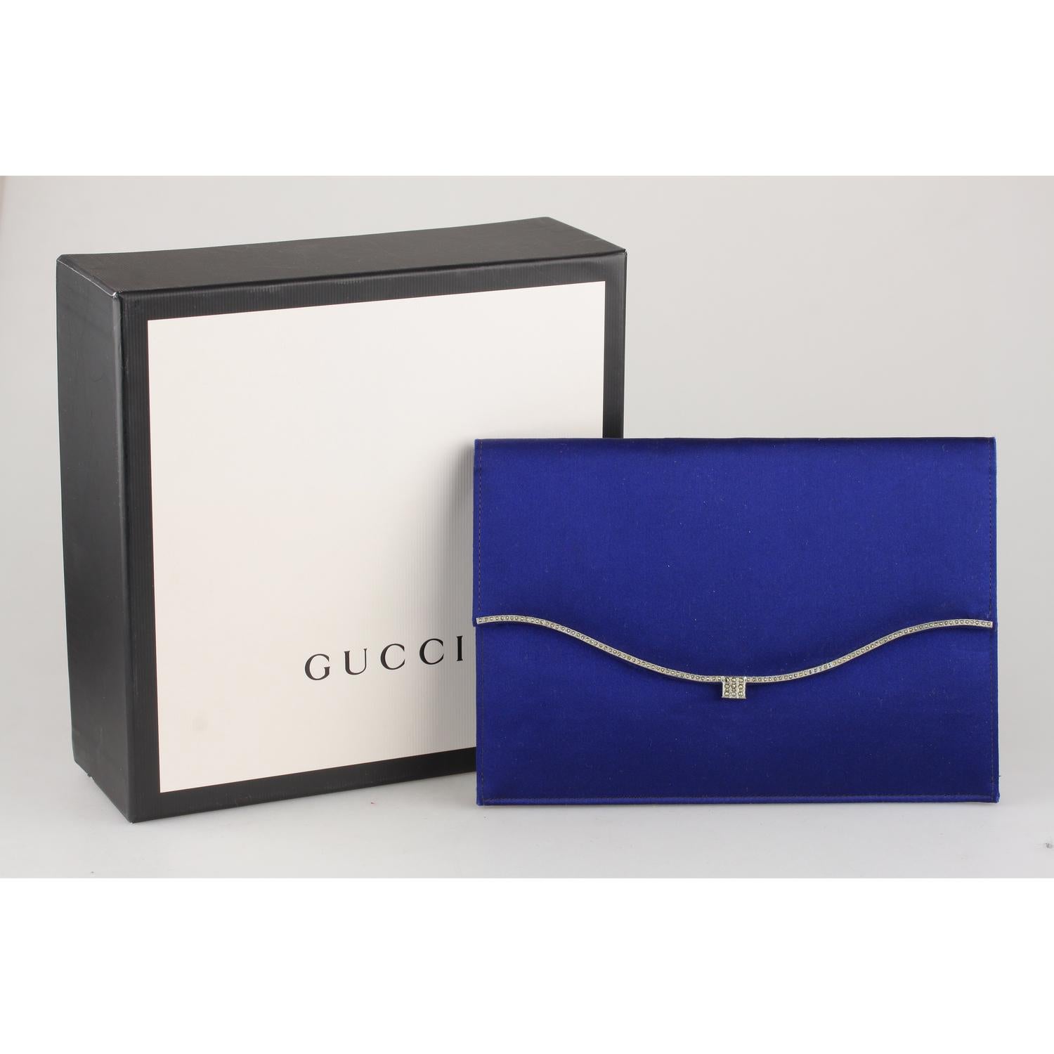 Vintage Gucci evening clutch bag in blue satin from the early 60s. 

Material: Satin
Color: Blue
Model: Evening Bag
Gender: Women
Country of Manufacture: Italy
Size: Small bags
Bag Depth: -
Bag Height: 5 inches - 12,7 cm 
Bag Length: 7 inches - 17,8
