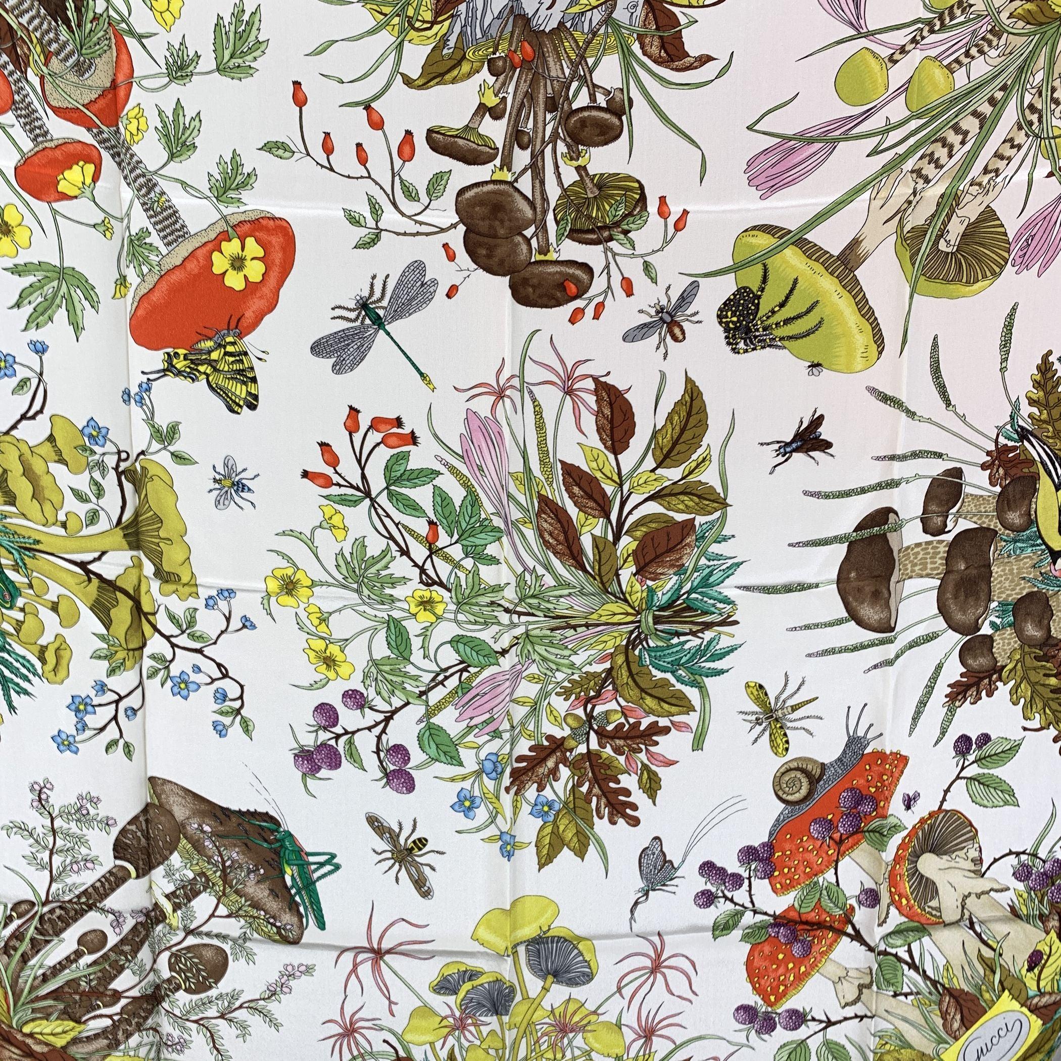 Gucci Vintage Floral 'Funghi' (Mushrooms) Silk Scarf. Blue borders. Designed by Vittorio Accornero for GUCCI in 1967. Multicolor flowers and mushrooms design. 100% Silk. Measurements: 34.5 x 34.5 inches - 87,5 x 87,5 cm. Printed GUCCI signature,