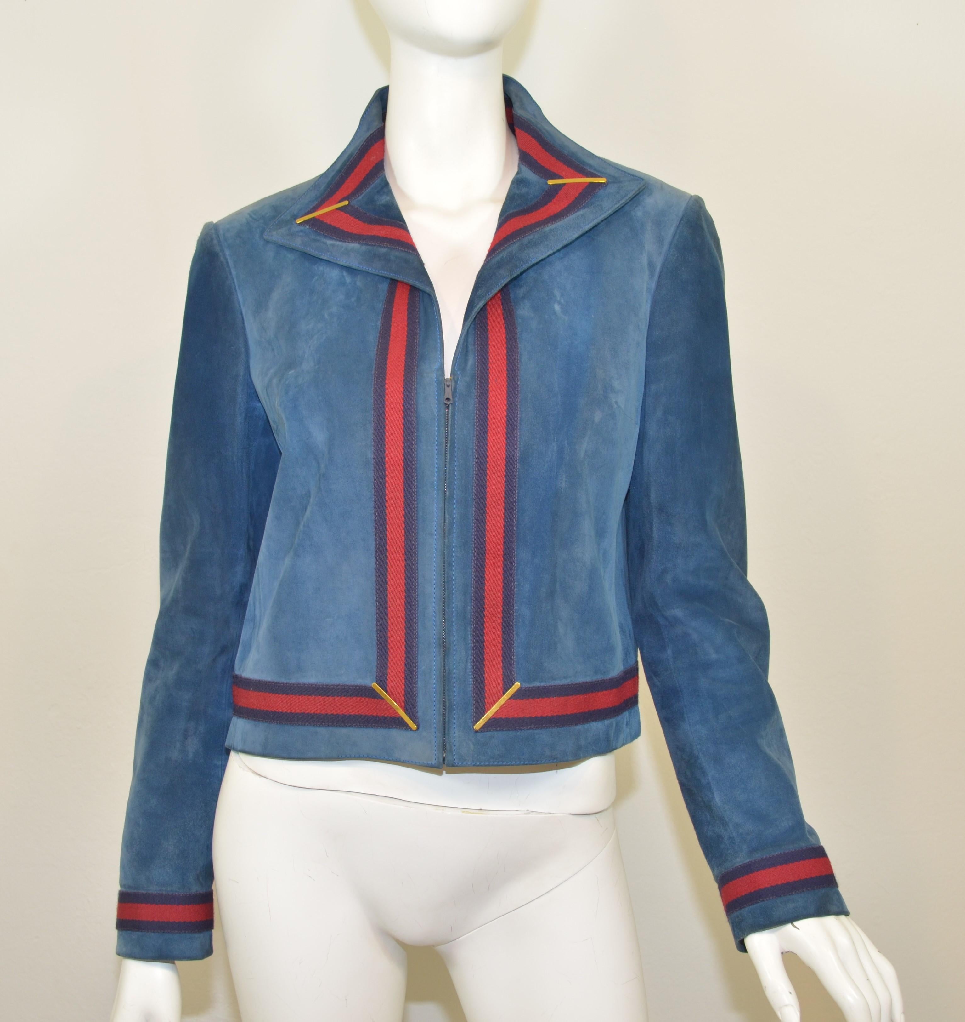 Vintage Gucci jacket is featured in a blue suede leather with the signature red/blue web trimming. Jacket has a zippered front and is fully lined, labeled size 48. Jacket is in great vintage condition with normal wears. See photos