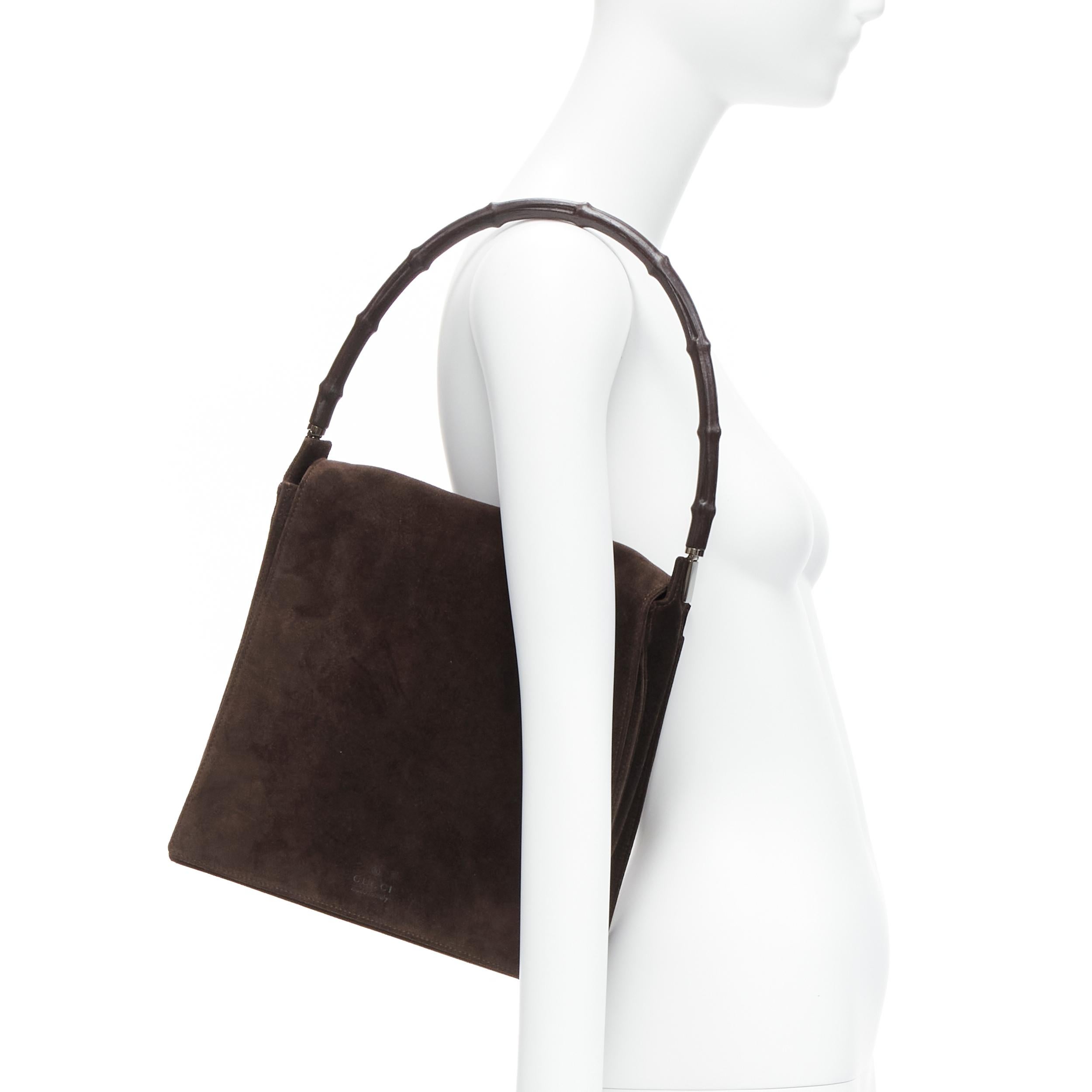 GUCCI Vintage brown bamboo handle suede leather flap shoulder bag
Reference: TGAS/D00240
Brand: Gucci
Collection: Bamboo
Material: Suede, Bamboo
Color: Brown
Pattern: Solid
Closure: Magnet
Lining: Brown Fabric
Extra Details: GUCCI logo on top of