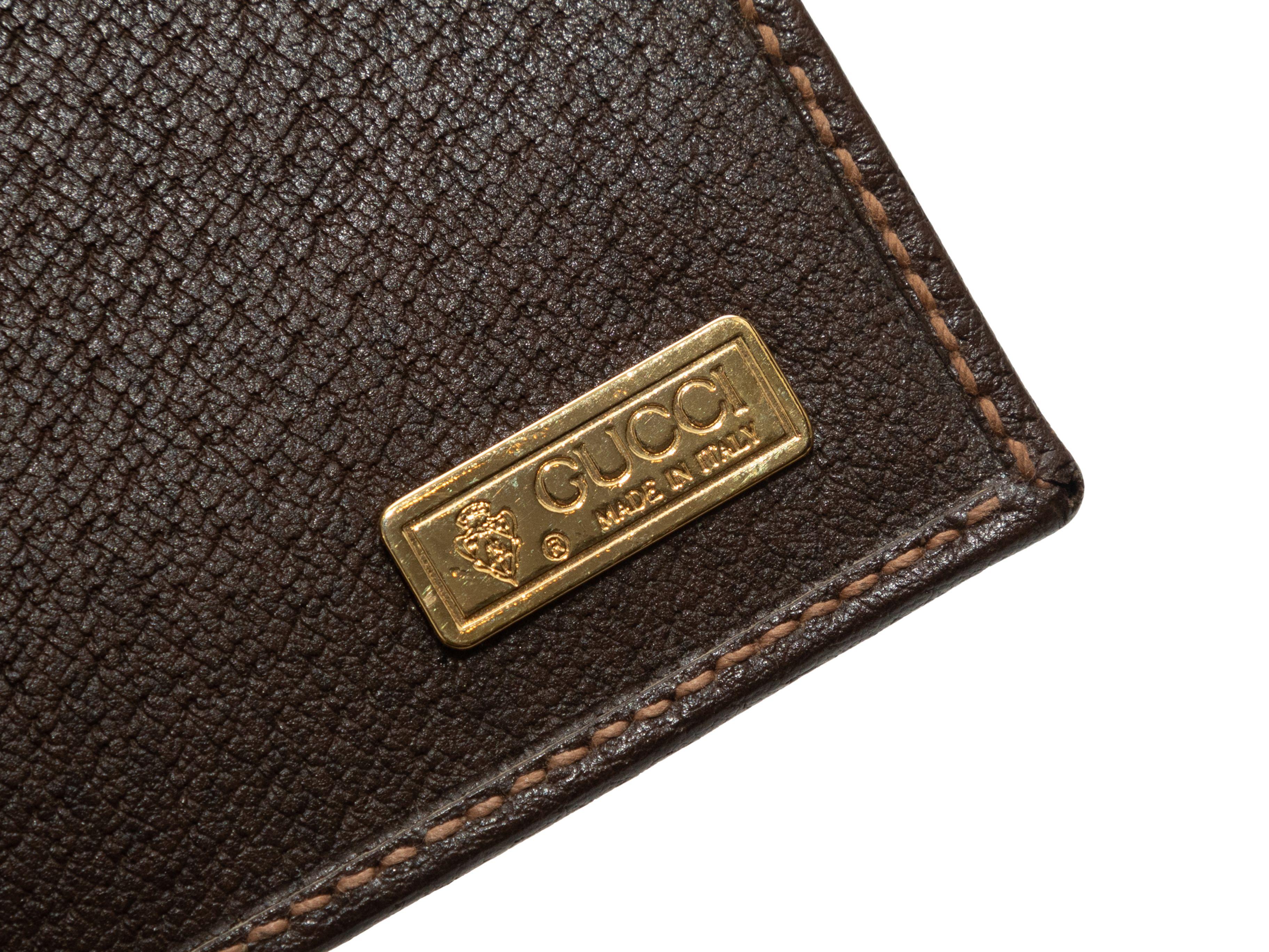 Details zum Produkt: Vintage braune GG beschichtete Leinwand Scheckheftmappe von Gucci. Lederbesatz. 3.75