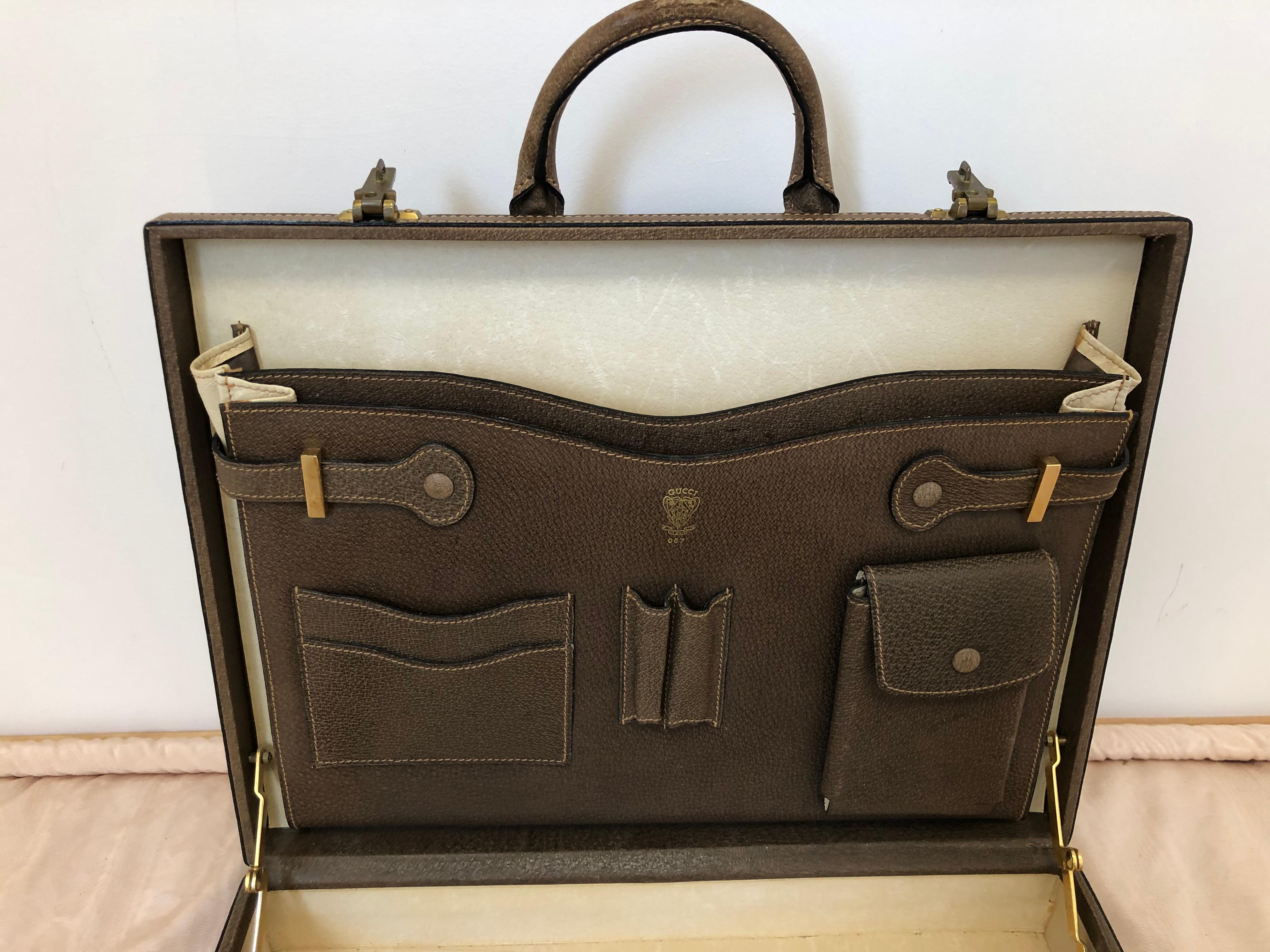 This Gucci briefcase is gorgeous in great vintage condition and practical as it will hold documents and a laptop.  It is a hard case, so will protect your equipment from harm. The briefcase comes with built-in compartments for pens, phone, cards,