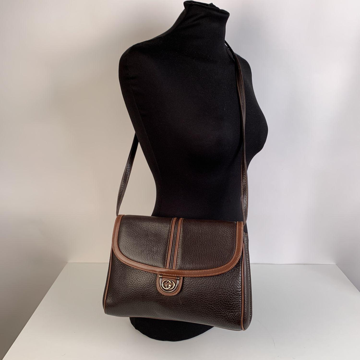 Gucci vintage brown leather crossbody bag. Can be used as a clutch purse if you remove its strap. Flap with magnetic button closure. GG - GUCCI logo on the front. Brown suede lining. 1 side zip pocket inside. Removable and adjustable shoulder strap.