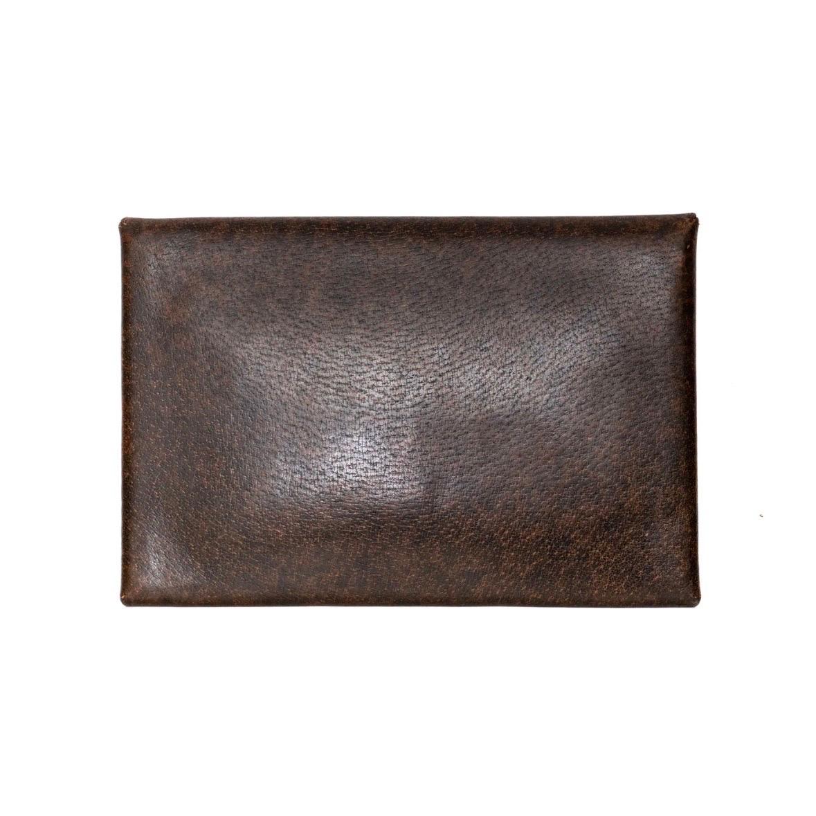 Brown leather envelope clutch by Gucci
Circa 1970s
Snap button closure with gold-tone bridle charm
Interior pocket beneath flap
Suede leather lining 
Clutch size
100% leather
Made in Italy
Condition: excellent vintage condition; minor pen marks