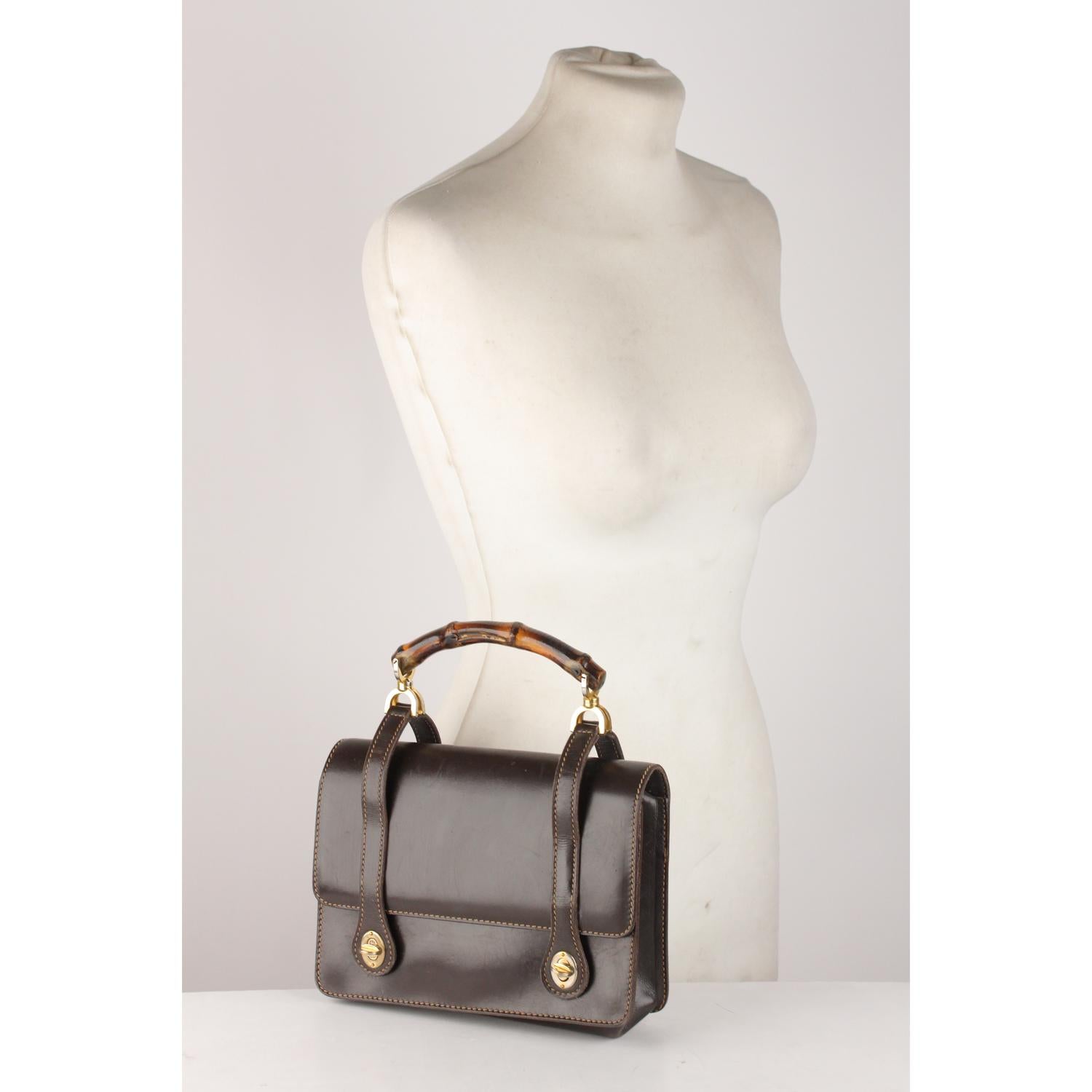 Gucci Vintage Brown Leather Handbag with Bamboo Handle

Material: Leather 
Color: Brown
Model: Top Handle Bag 
Gender: Women
Country of Manufacture: Italy
Size: Small Bags
Bag Depth: 3. inches - 7,6 cm 
Bag Height: 6.5 inches - 16,5 cm 
Bag Length: