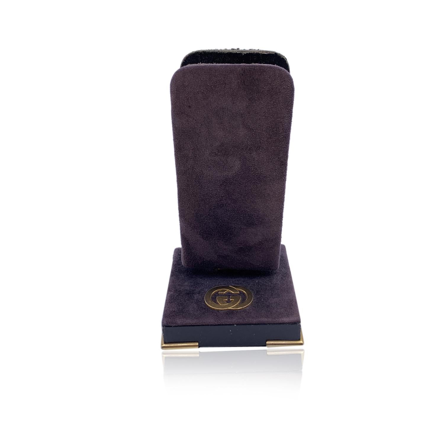 Vintage Gucci pen holder covered in brown leather and suede. GG logo in golden metal on the base. The upper part is rotatable. 'Made in Italy by Gucci' embossed on the bottom.

Details

MATERIAL: Suede

COLOR: Brown

MODEL: -

GENDER: Unisex