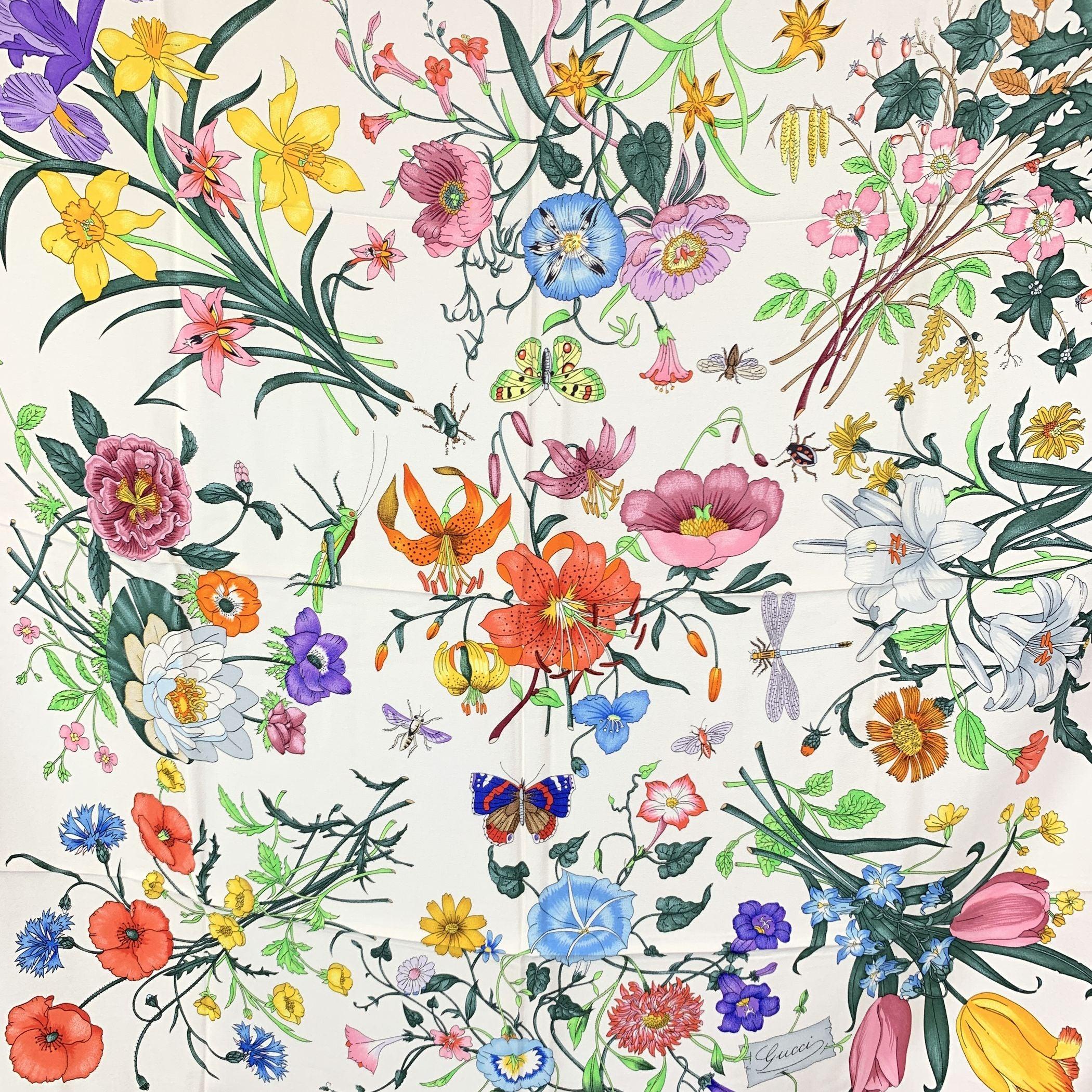 Discover the world of timeless elegance with this stunning vintage 'Flora' silk scarf, designed by the renowned artist Vittorio Accornero in 1966 for Gucci. Accornero, who served as the textile designer for Gucci from the 1960s to 1981, crafted this