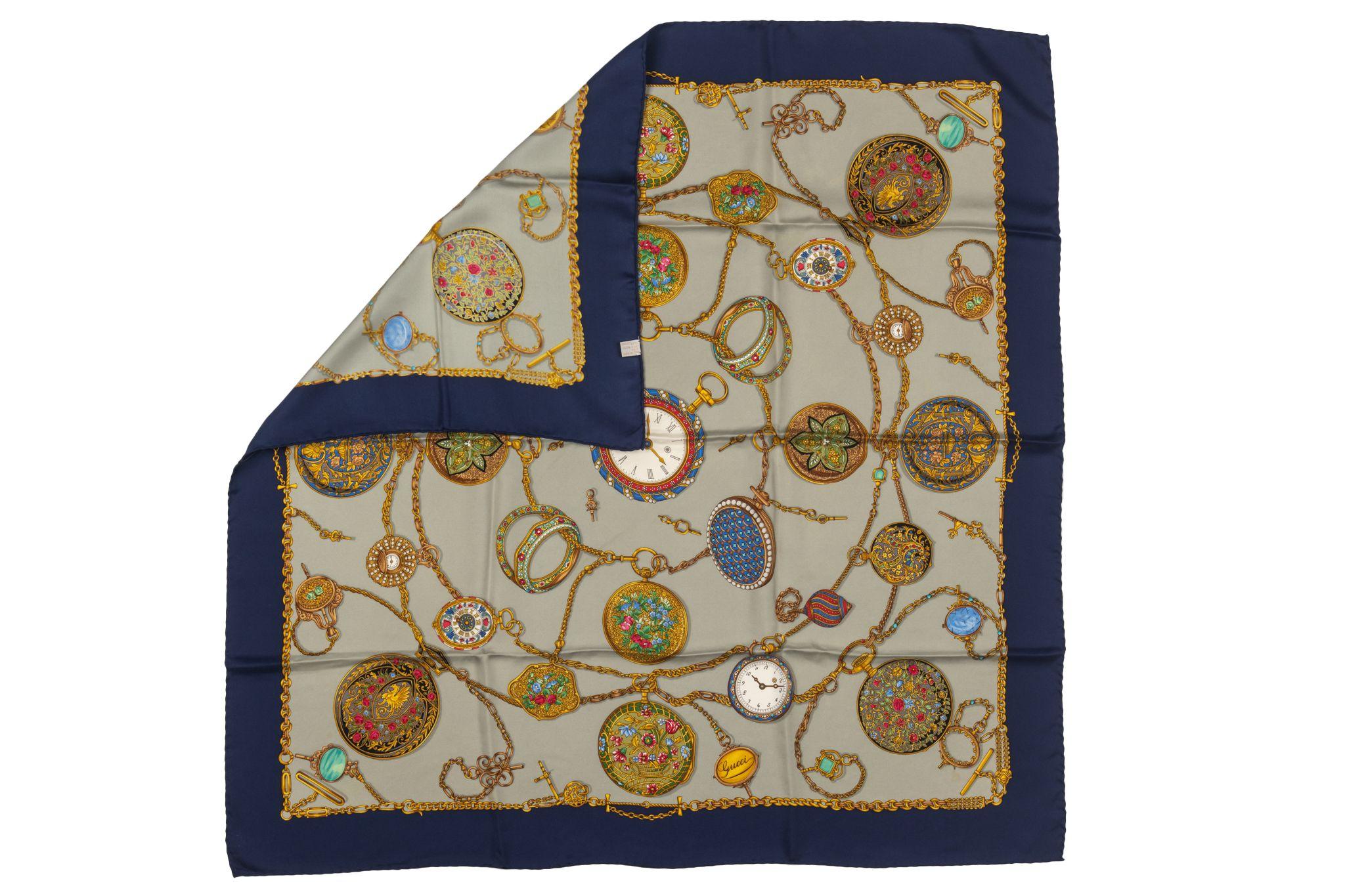 Gucci Vintage Clock Silk Scarf. The piece's print shows different clocks. It is in good condition and has minor stain.