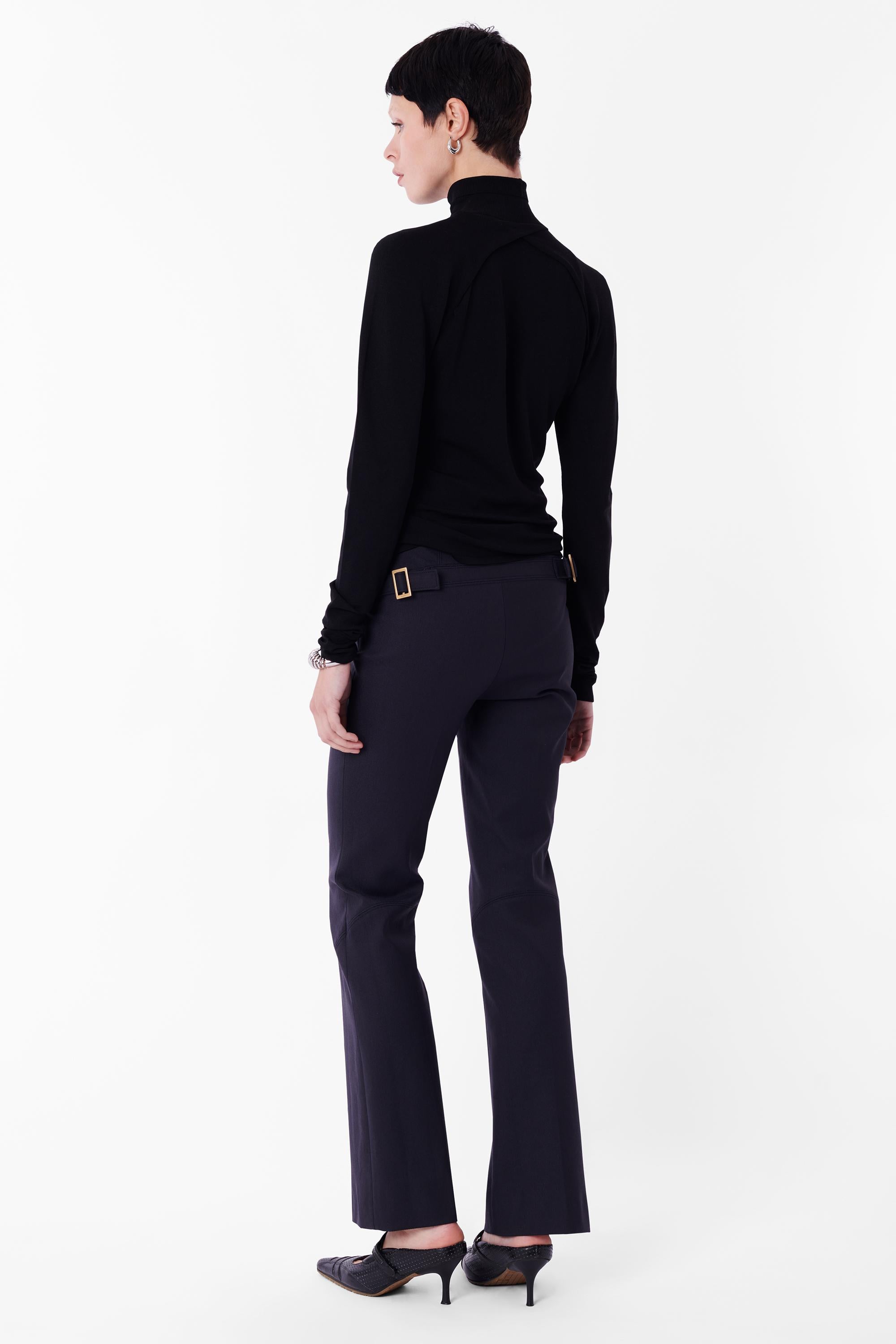 Vintage F/W 2003 Tom Ford for Gucci black longsleeve top. Features front cut out at the chest, ribbed foldable turtleneck and long sleeves in a bodycon fit. In great vintage condition.

Brand: Gucci
Size: UK 8
Color: Black
Modern Size: UK: 8-10, US: