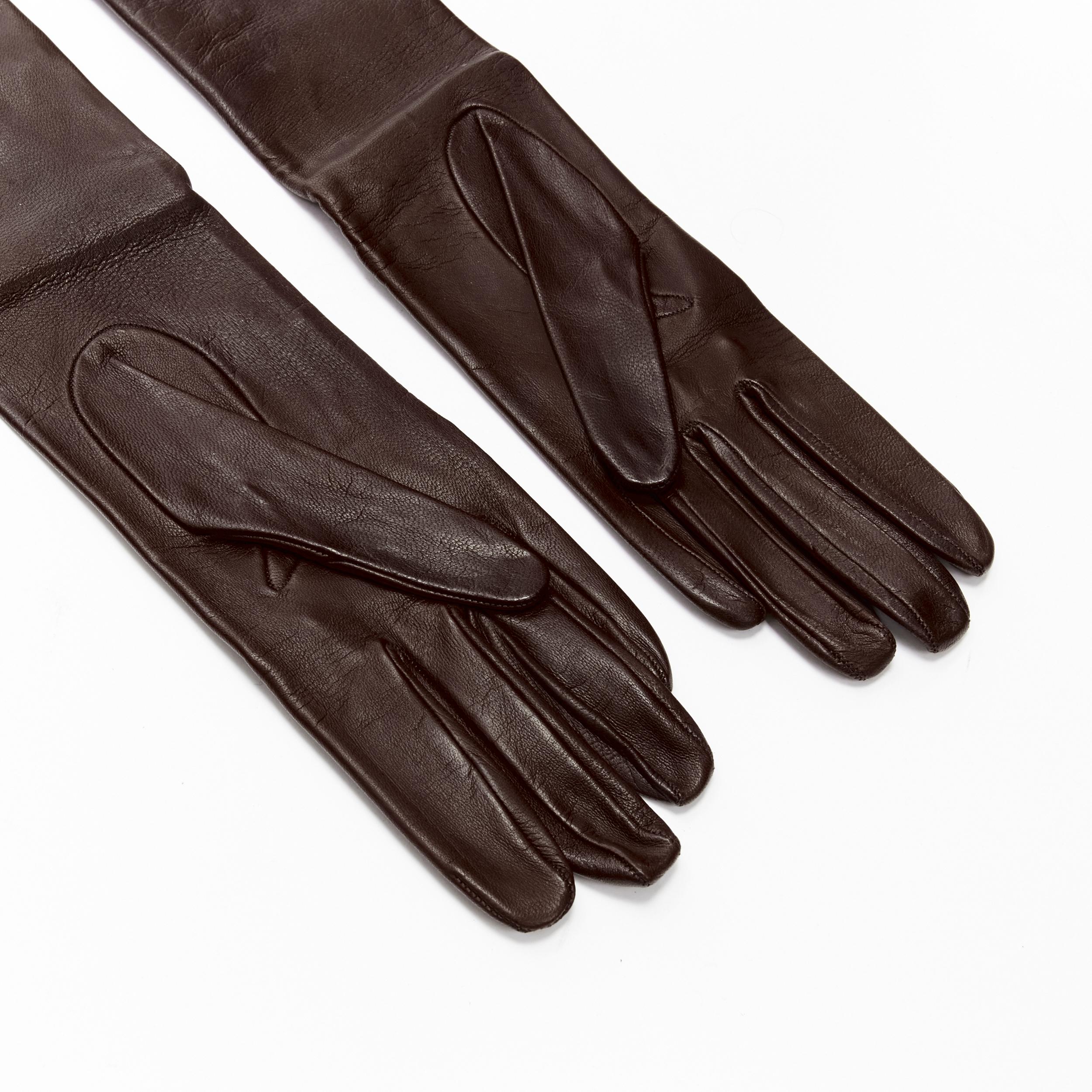 GUCCI Vintage dark brown leather gold stud trim long gloves Sz.7
Brand: Gucci
Designer: Tom Ford
Material: Calfskin Leather
Color: Brown
Pattern: Solid
Made in: Italy

CONDITION:
Condition: Very good, this item was pre-owned and is in very good