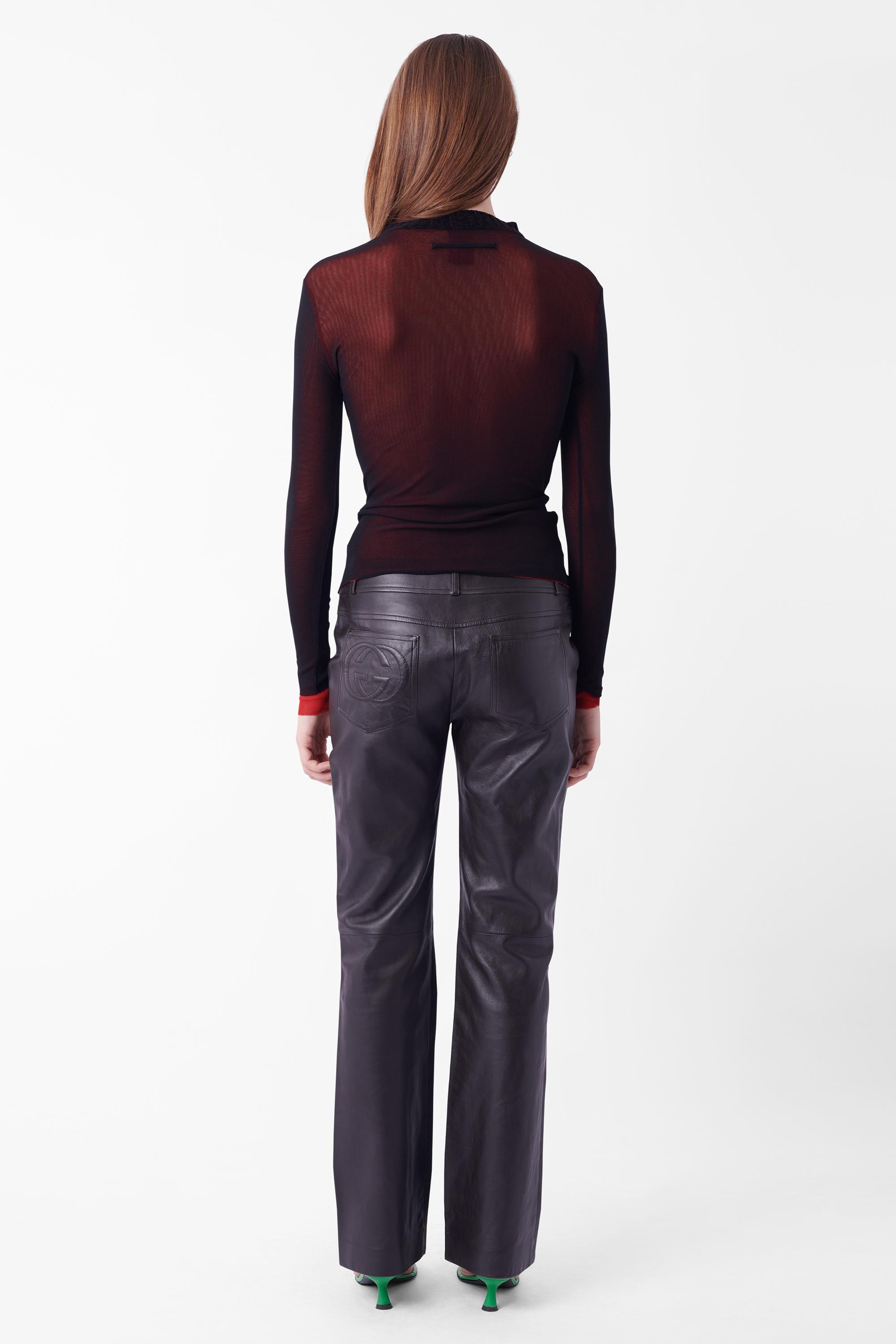 We are excited to present this Tom Ford for Gucci Fall Winter 2003 GG logo leather trousers. Features two front and back operational pockets, front zips at pocket, belt loop detailing, GG embossed leather on back pocket. In excellent vintage