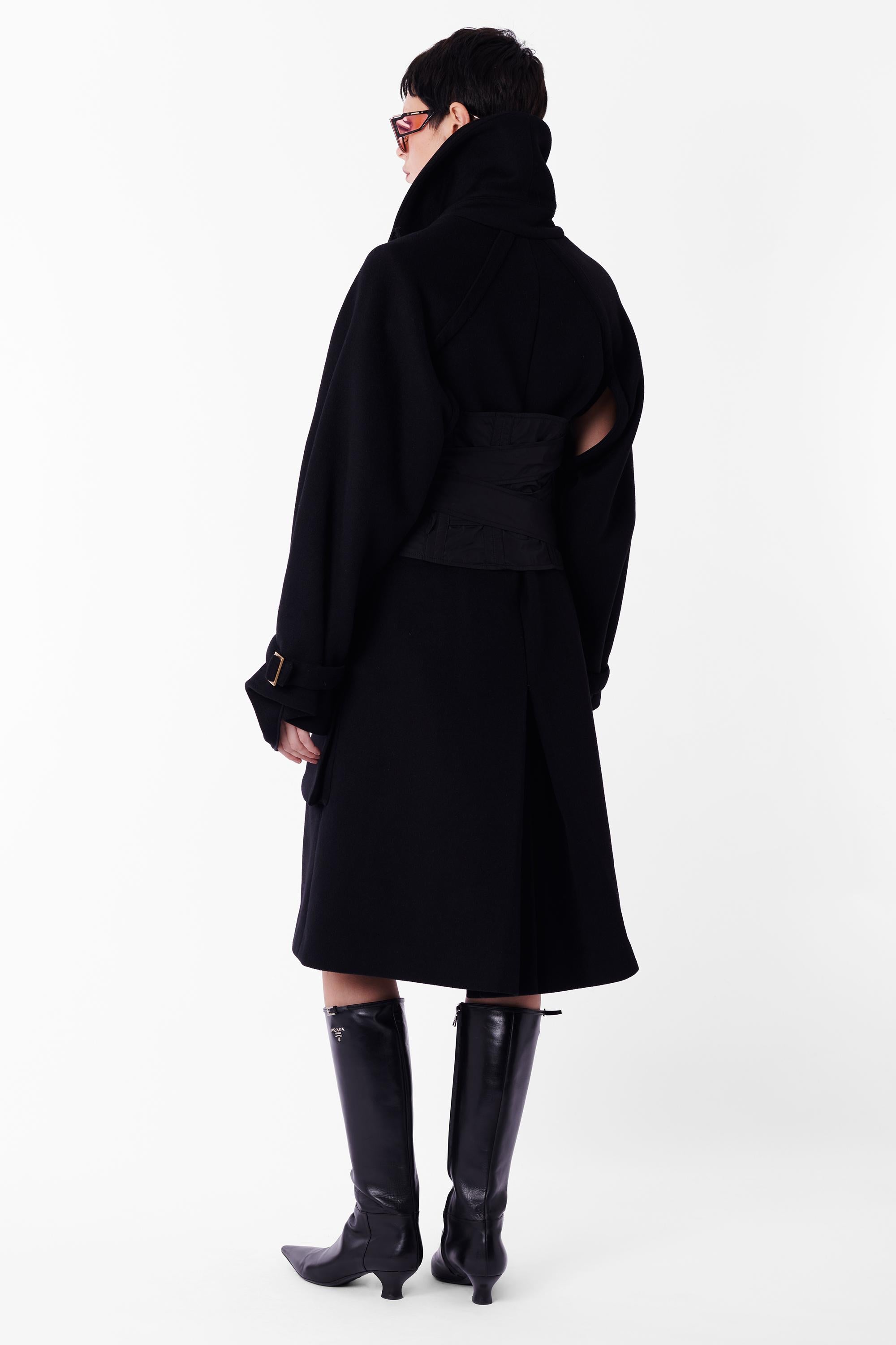 Vintage Tom Ford for Gucci Fall Winter 2003 black wool oversize coat and corset belt. As seen on the runway, look 1 in white opening the show. Features oversize shawl collar able to be worn up or down, two oversized front pockets, open under arms,