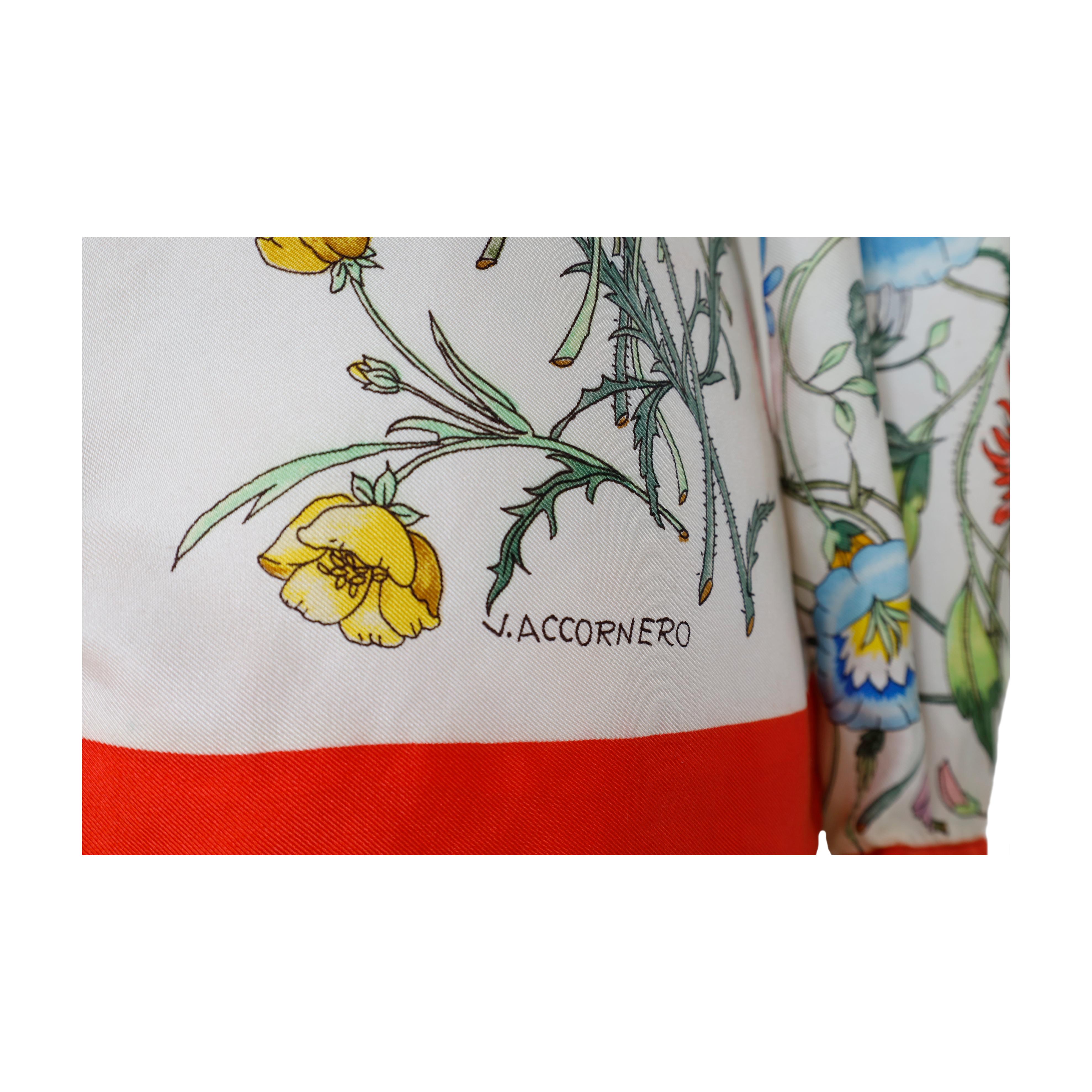 A vintage shirt by Gucci's first clothing line 'Flora' featuring the mythical floral pattern that is constantly re-introduced by the brand. The shirt features a vivid red border extending across the collar, sleeve cuffs, and lower hem. The buttons