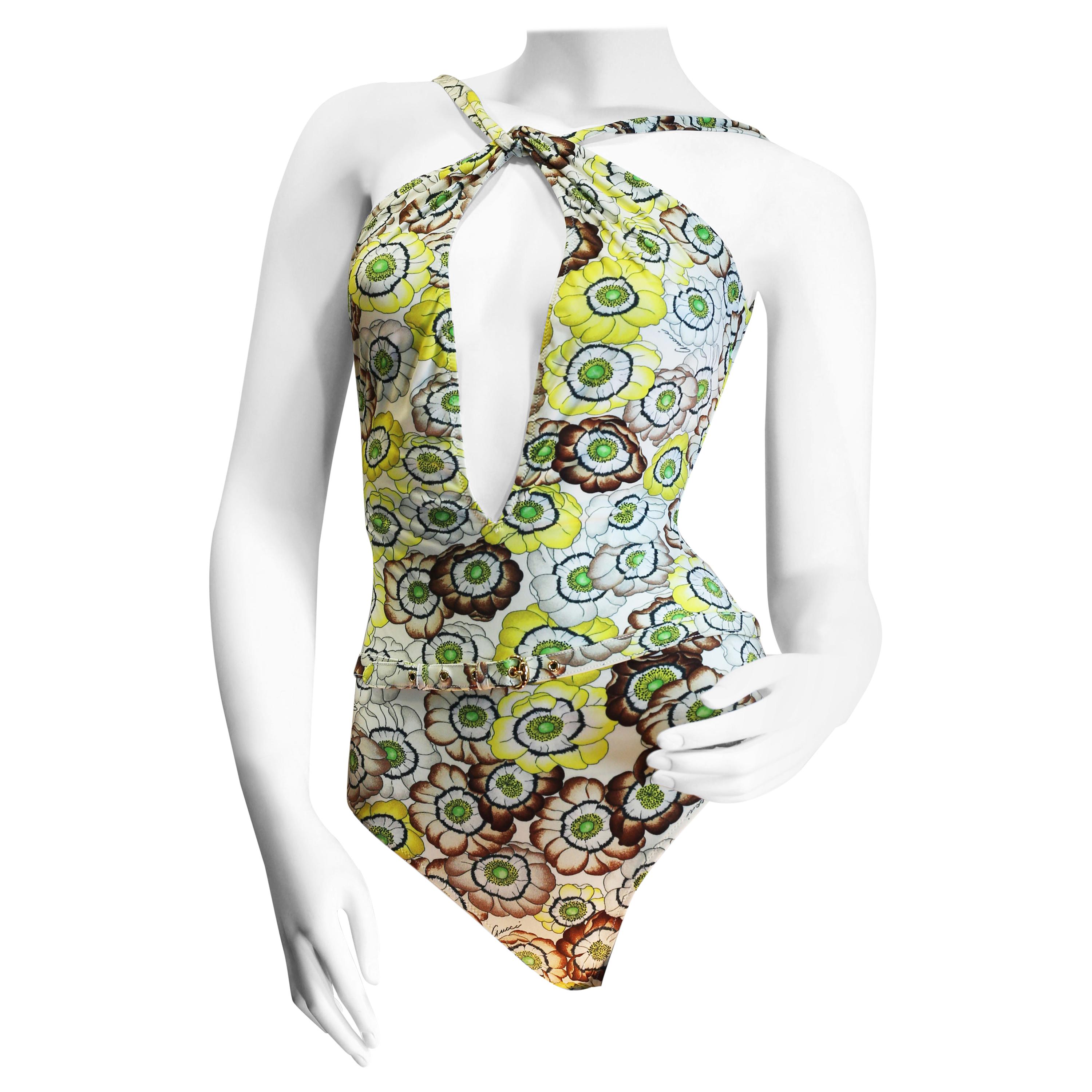 Gucci vintage flowers enhances a sparkling swimsuit in light summerly colours 