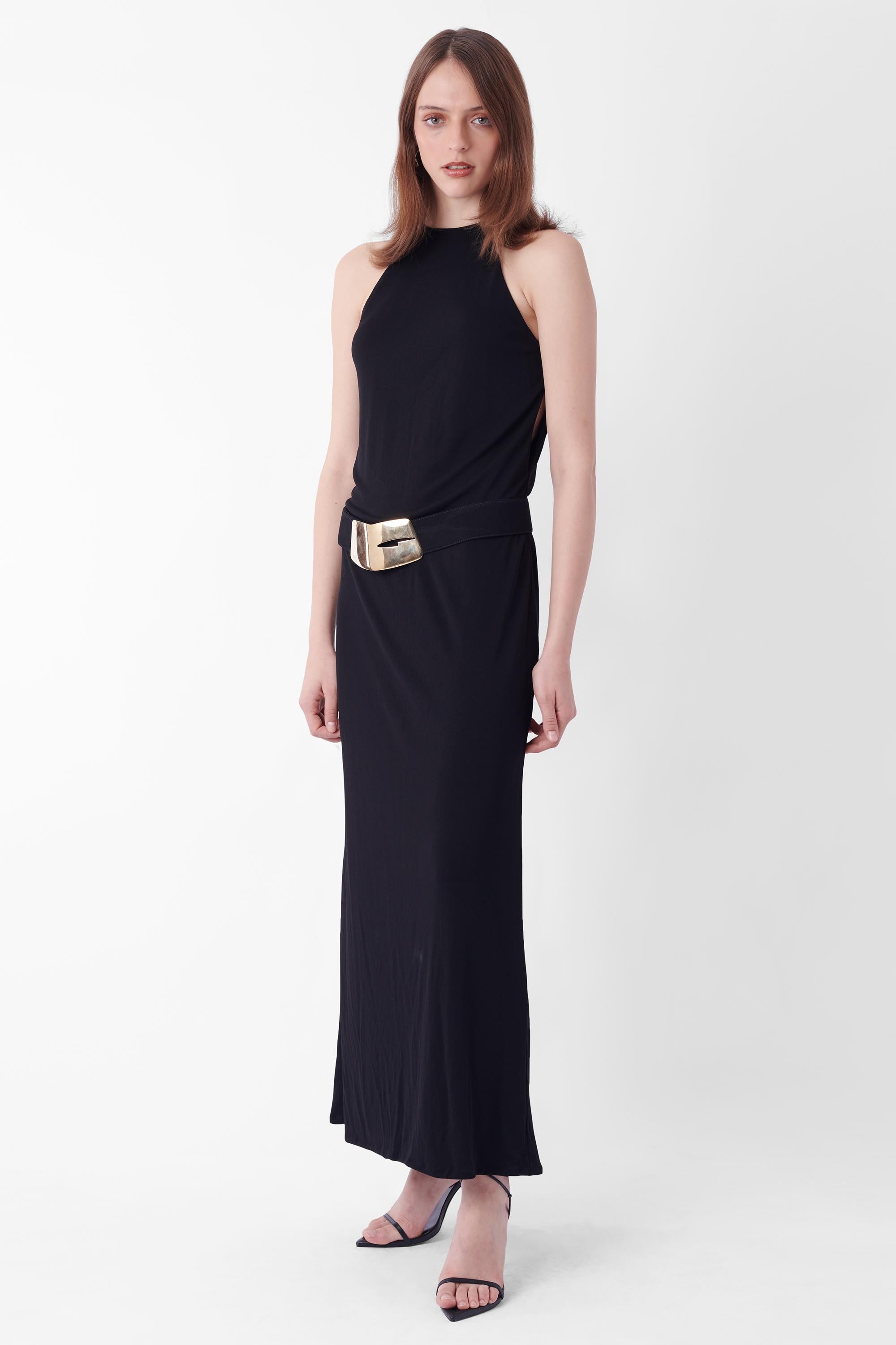 Gucci Fall Winter 1996 black maxi dress. Features high neck detailing with thin straps, keyhole sides & back opening and gold hardware belt with ‘Gucci’ engraving - as seen on the runway. In excellent vintage condition.
Brand: Gucci
Size: UK