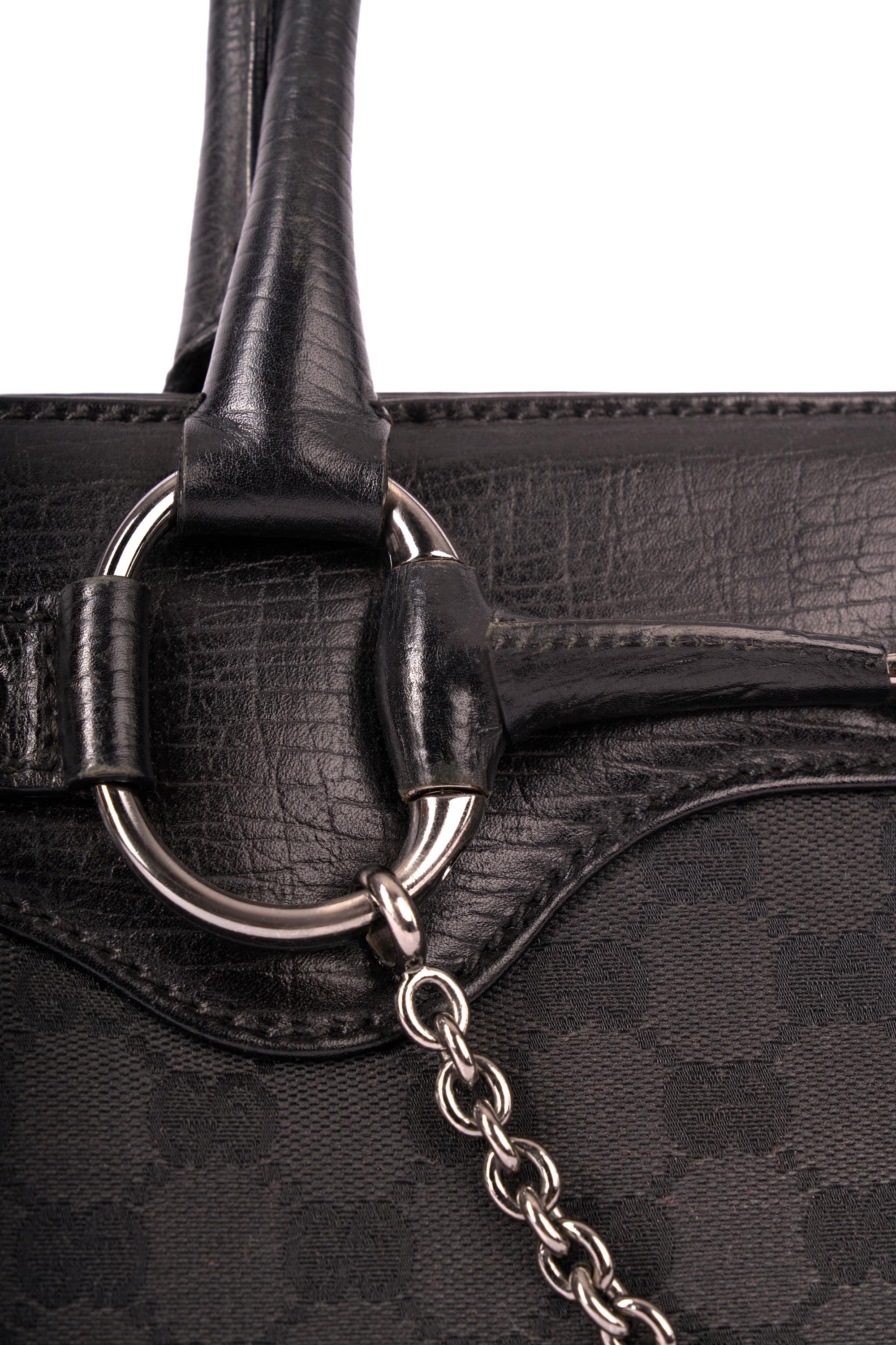 Gucci by Tom For GG black monogram canvas shoulder bag. Features signature GG logo canvas with leather trim, chain detail, silver horsebit chain, inside zip back pocket. In excellent vintage condition.

Brand: Gucci
Color: Black
Shoulder Bag
Fabric: