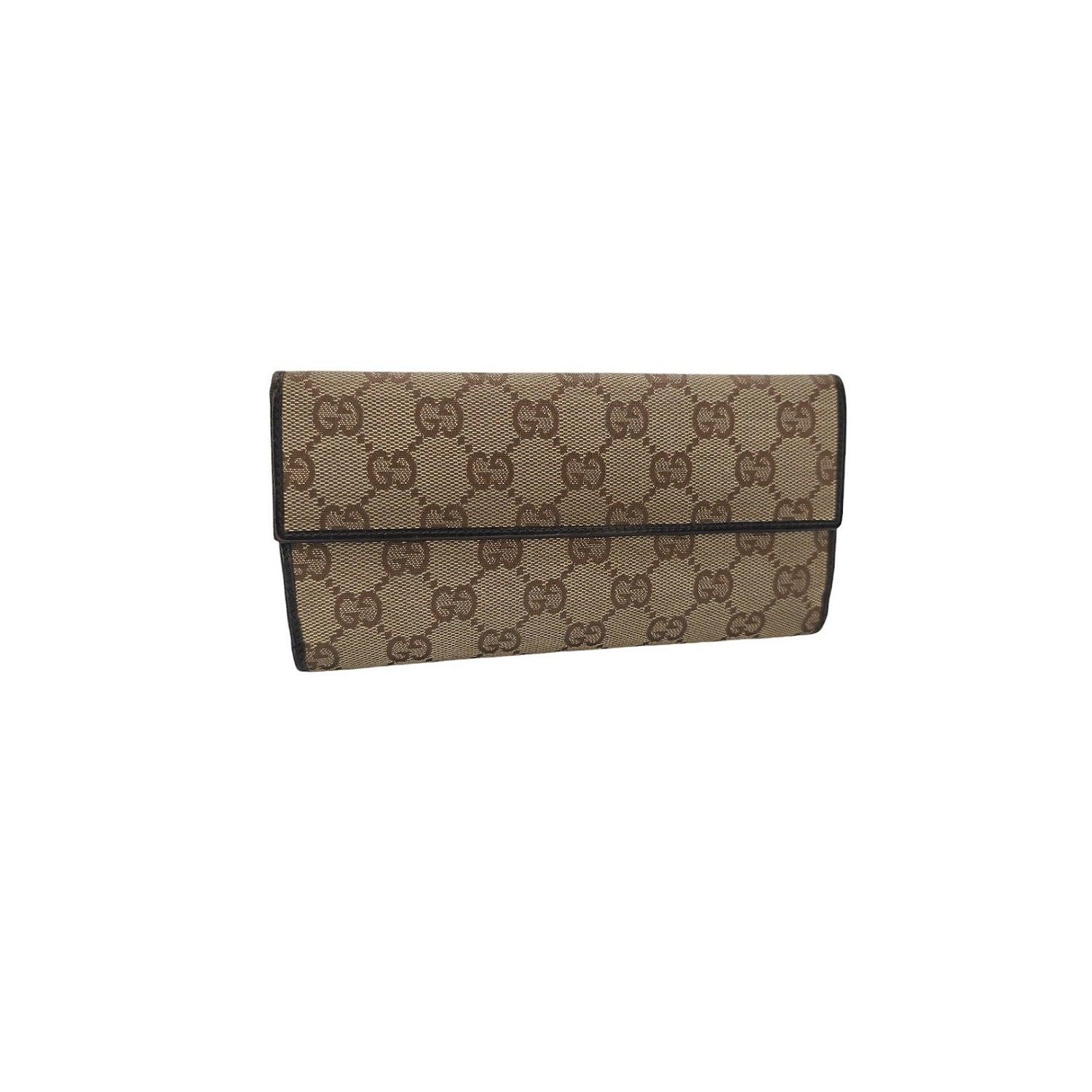 Expertly crafted in Italy, this Gucci GG Continental Wallet with Horsebit Clasp features the iconic GG monogram and a luxurious leather interior. The signature horsebit clasp opens to reveal a spacious interior with multiple compartments for cards,