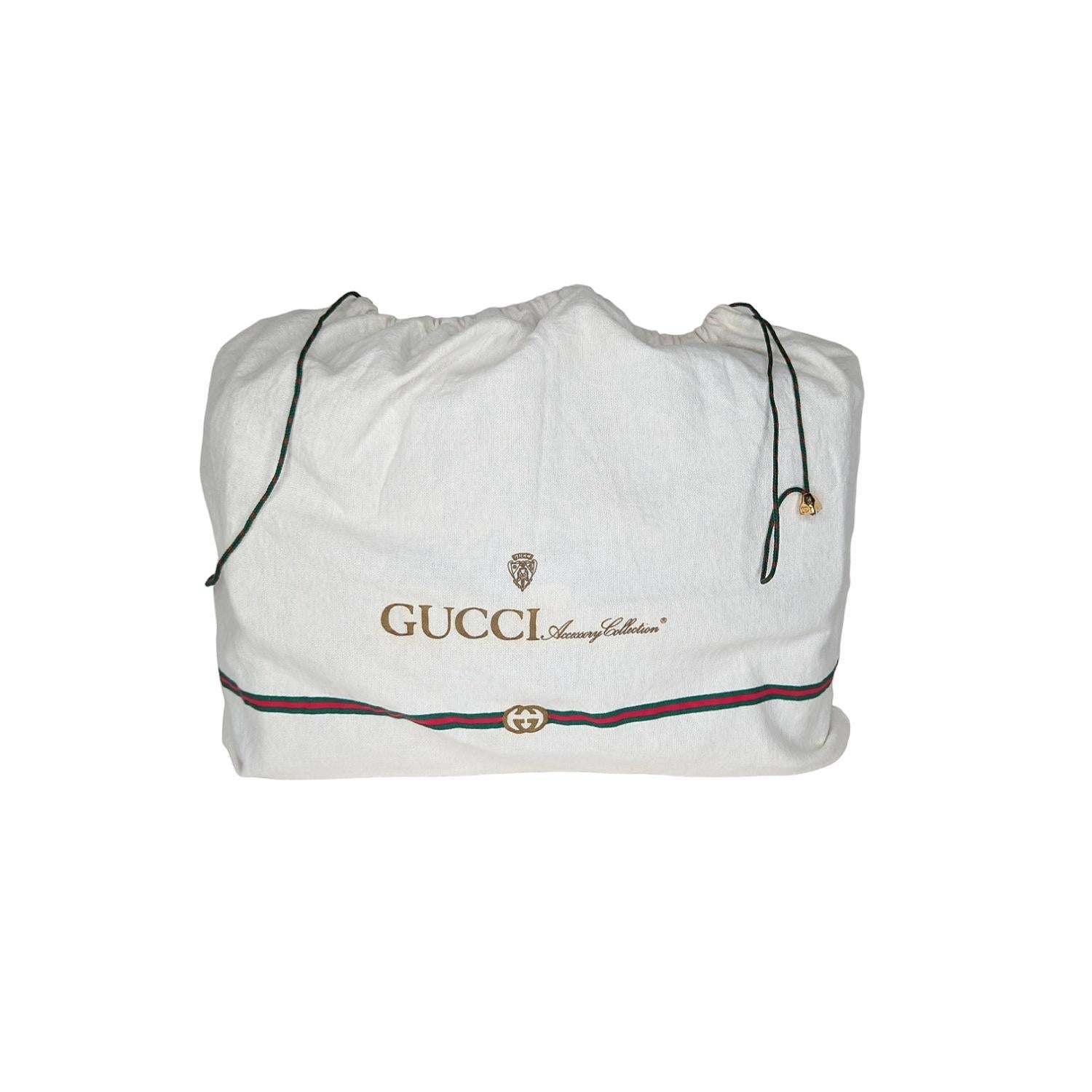 This vintage Gucci messenger bag is a timeless piece crafted from navy blue micro GG monogram canvas with PVC leather trim. Featuring an adjustable shoulder strap, gold-tone hardware, and a red and blue web stripe detail. The interior is lined with
