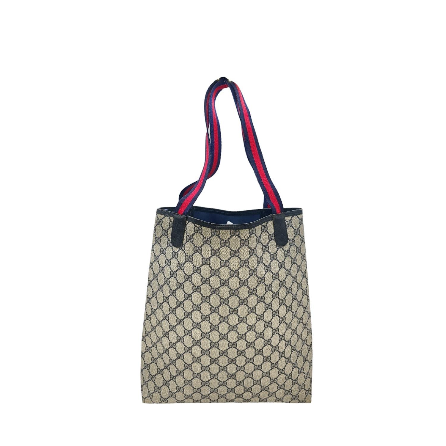 As stylish as it is spacious, this Gucci Vintage GG Monogram Sherry Tote is the perfect accessory for your everyday needs. Featuring the iconic GG Monogram coated canvas with leather trimming and gold-tone interlocking G logo, it offers a chic and
