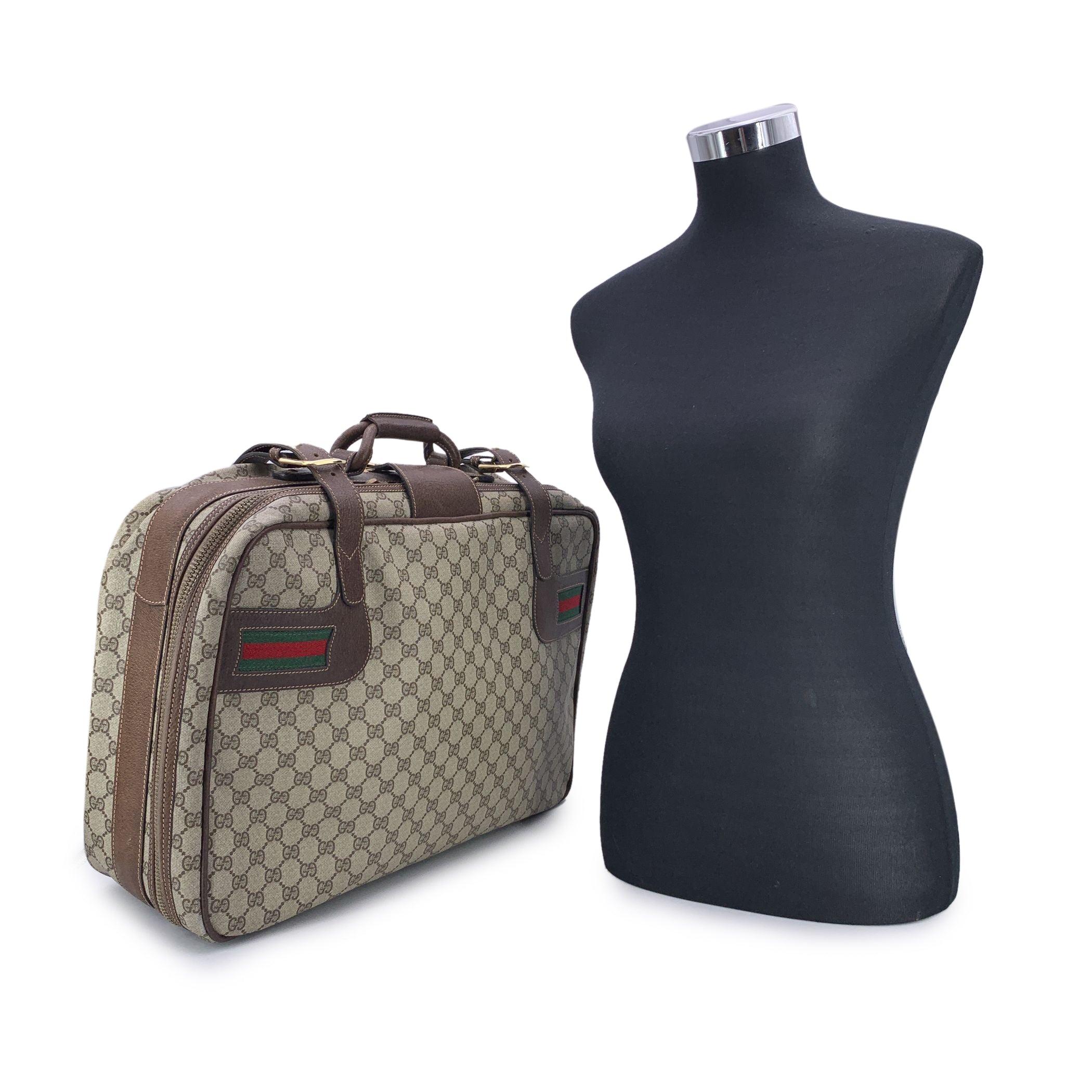 Step into a world of timeless luxury with this GUCCI Beige GG Monogram Canvas Suitcase, a vintage gem crafted by the legendary Italian brand. The iconic GG monogram is beautifully displayed across the canvas, exuding sophistication and style.