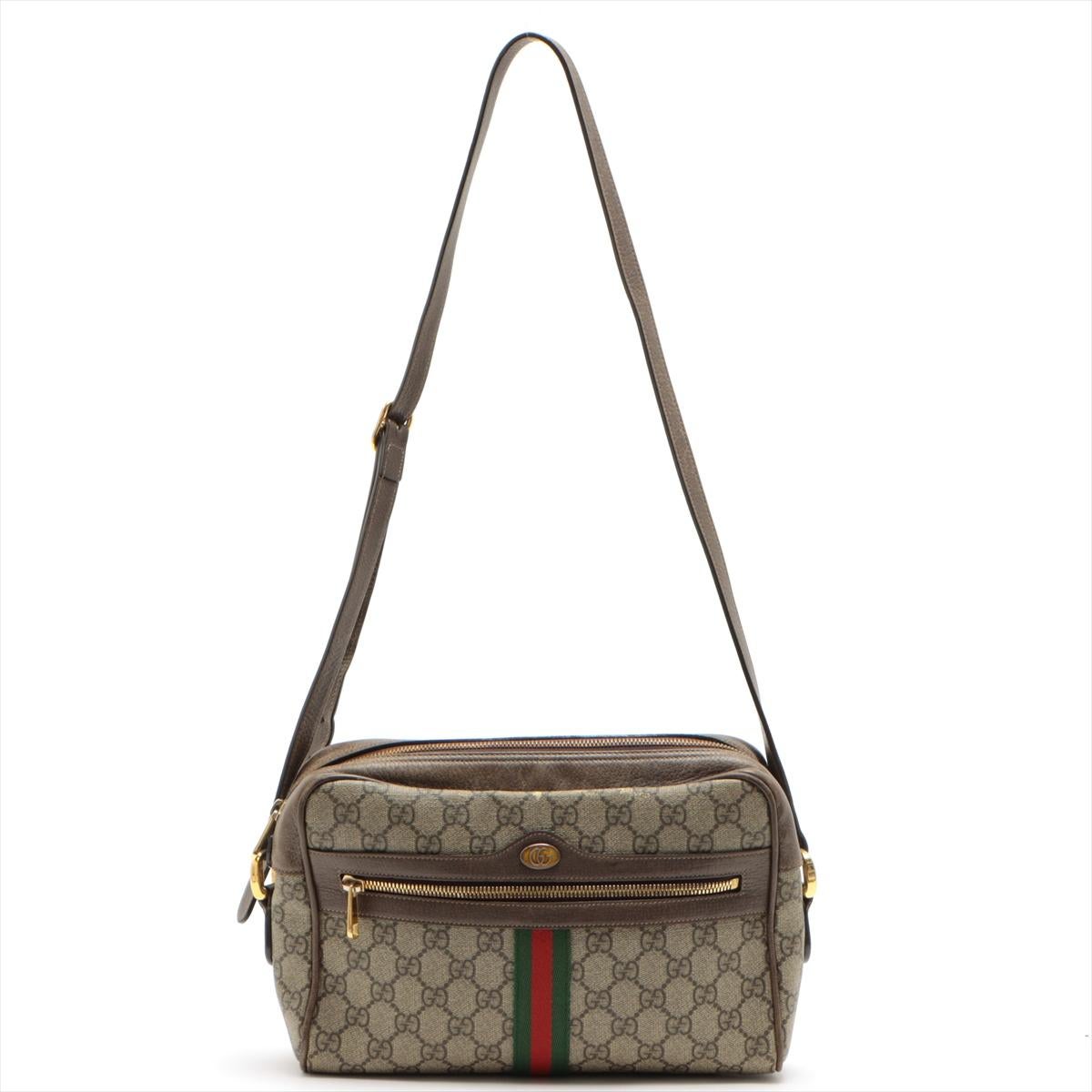 El Bolso de Hombro Gucci GG Supreme Ophidia en Beige es una fusión de elegancia clásica y estilo moderno. Confeccionada con la emblemática lona GG Supreme, la bandolera presenta un distintivo diseño Web en verde y rojo, que rinde homenaje a la