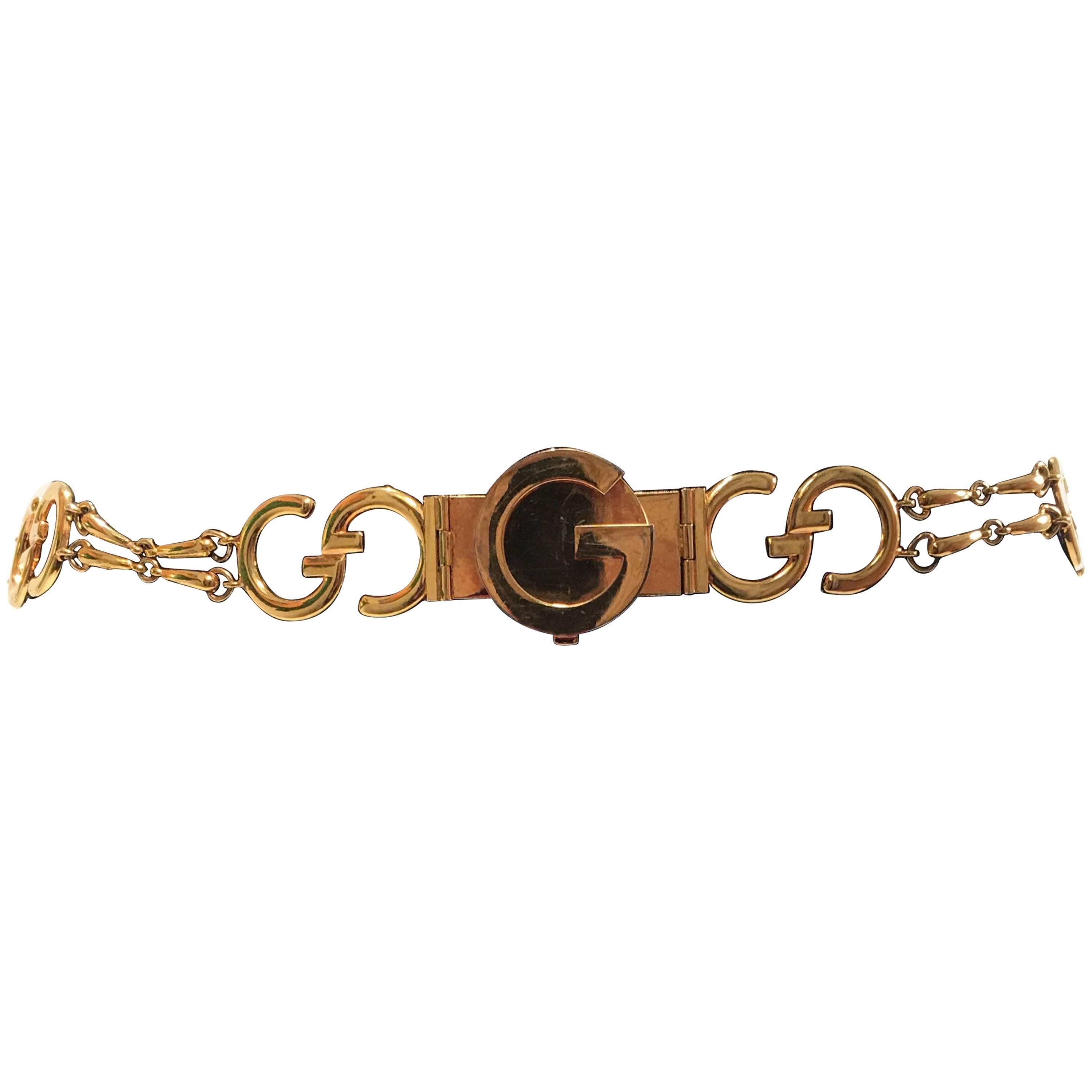 Ceinture Gucci vintage en or avec logo GG et chaîne dorée