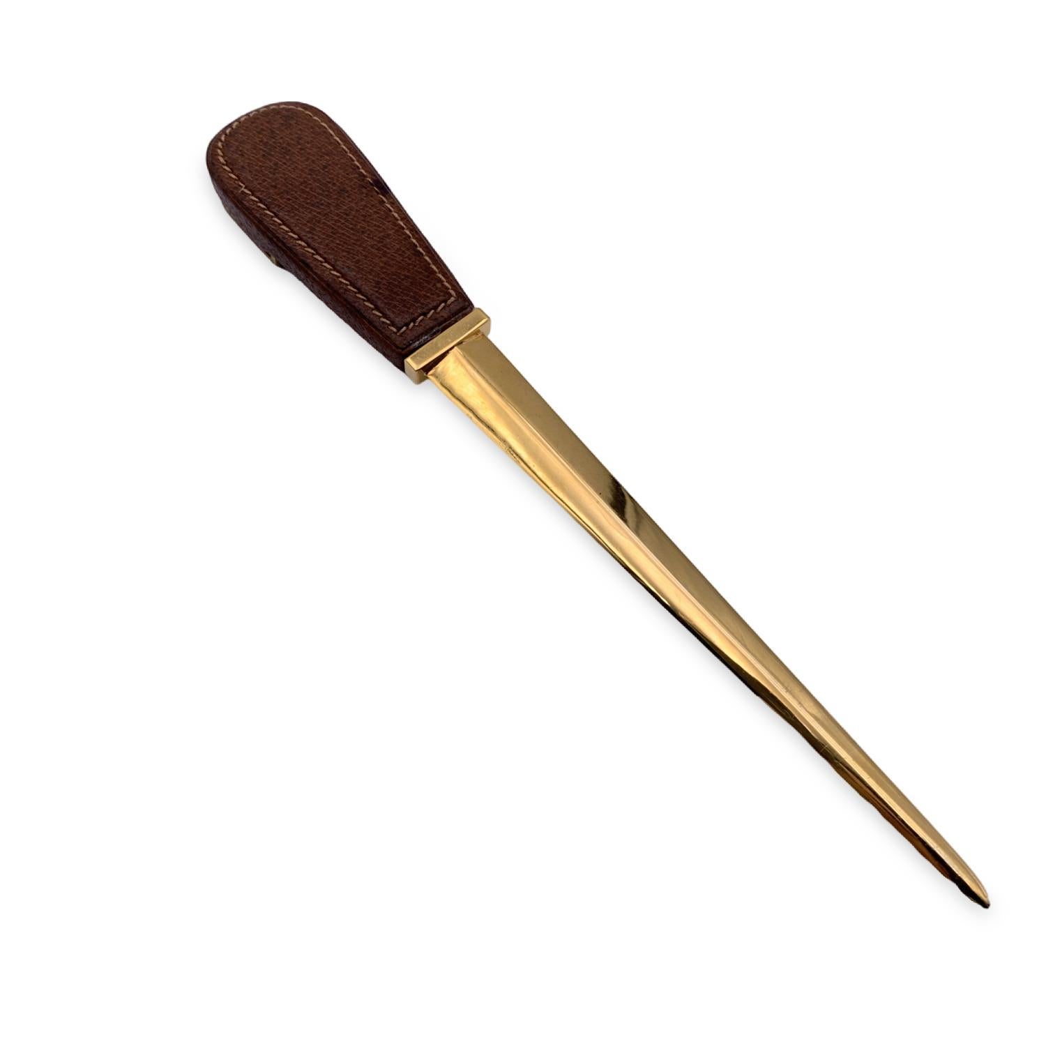 Vintage Gucci letter opener a gold-tone metal. Brown leather with gold metal hardware and GG logo on handle. Total lenght: 10.5 inches - 26.6 cm. 'Gucci taly' engraved at the base of the blade

Details

MATERIAL: Metal

COLOR: Gold

MODEL: