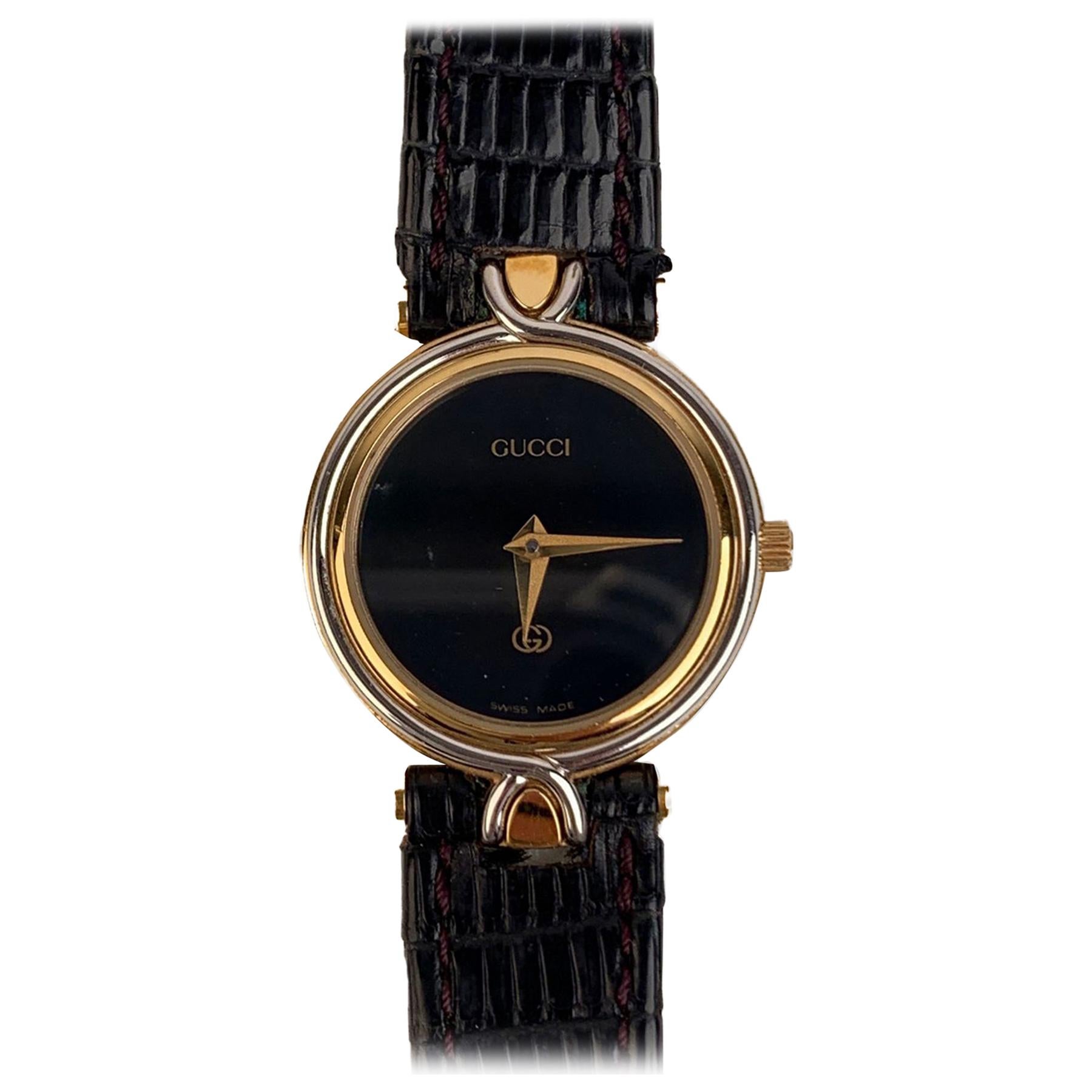 vintage black and gold gucci watch